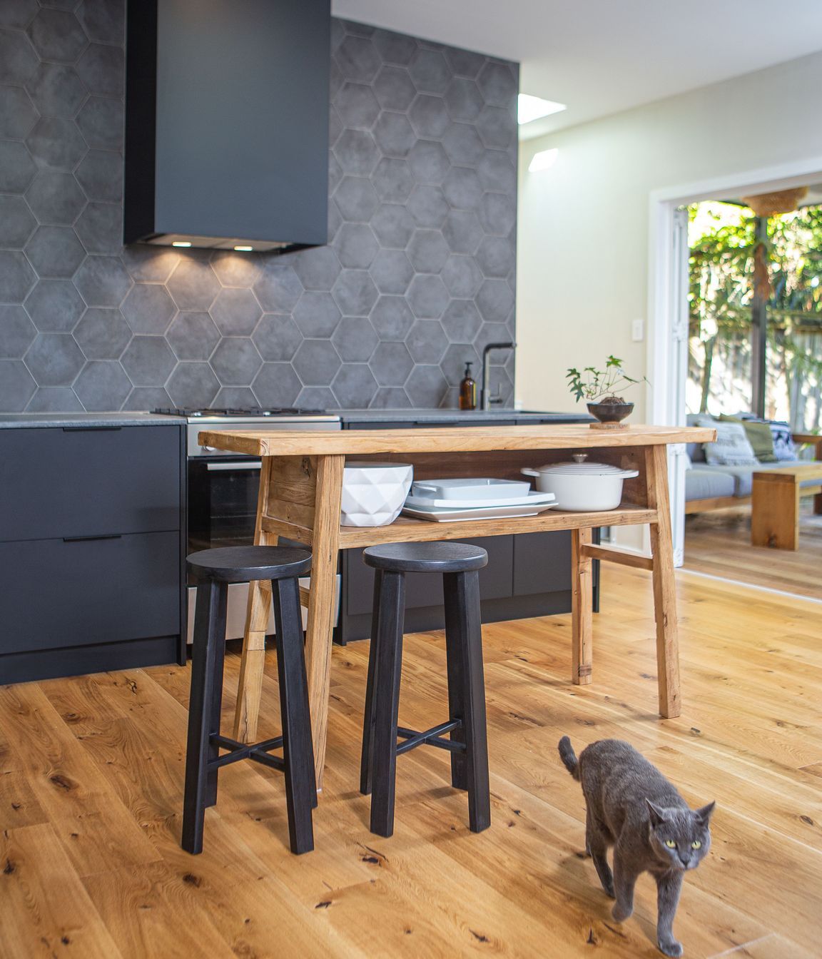 The heart of the home, where all other spaces converge, and where everyone comes together including the cat.
