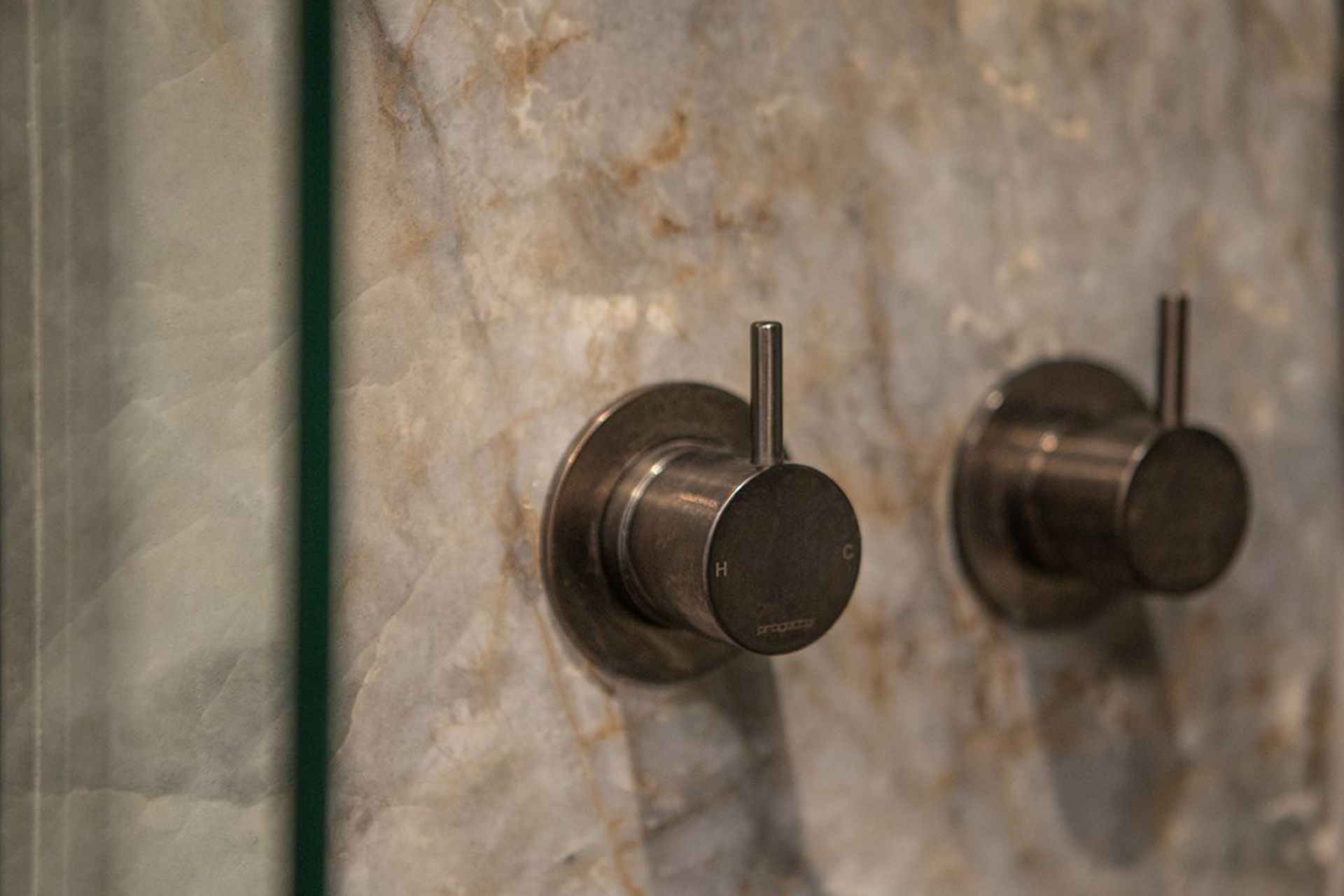 A large shower and two dumper heads, means two shower mixers. Mounted alongside each other for quick access from the sliding door opening.