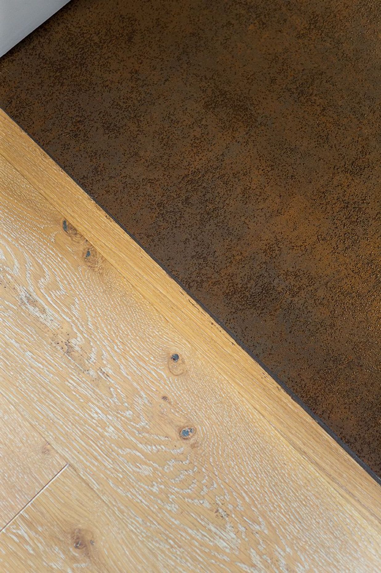 Seamless tiled floor transition to the engineered timber in the hallway.