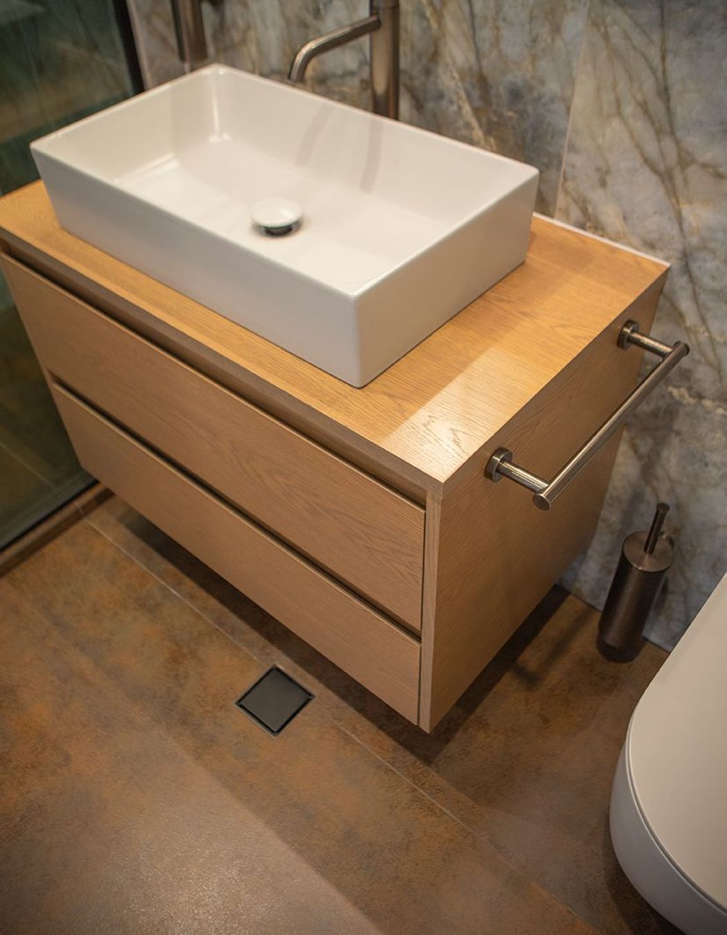 Gorgeous rusty Iron Cortex Satin stone, cut into tiles for the shower and bathroom floors, and also the skirting to the bathroom.