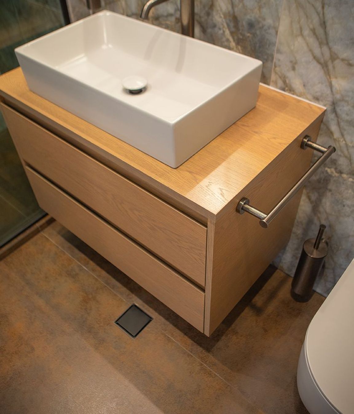 Gorgeous rusty Iron Cortex Satin stone, cut into tiles for the shower and bathroom floors, and also the skirting to the bathroom.