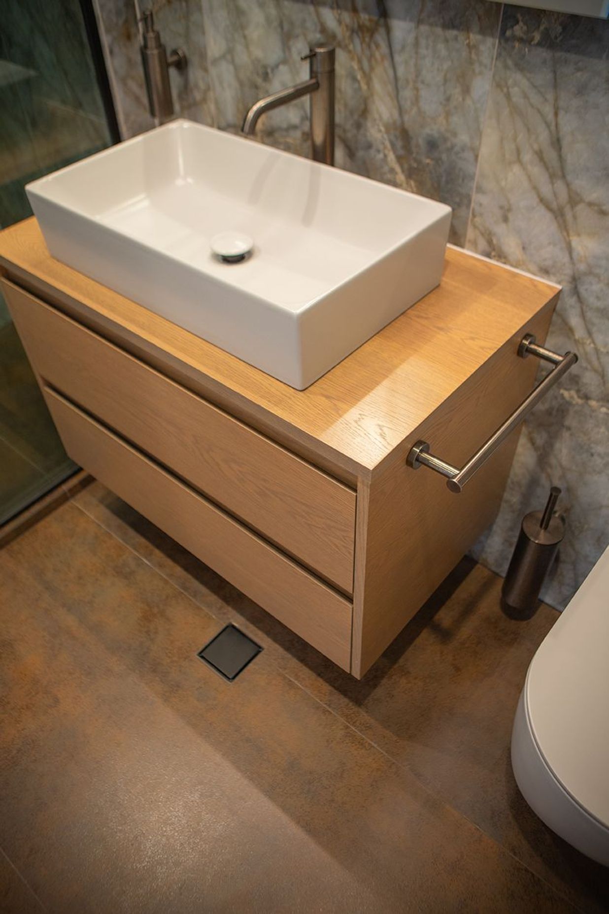 Gorgeous rusty Iron Cortex Satin stone, cut into tiles for the shower and bathroom floors, and also the skirting to the bathroom.