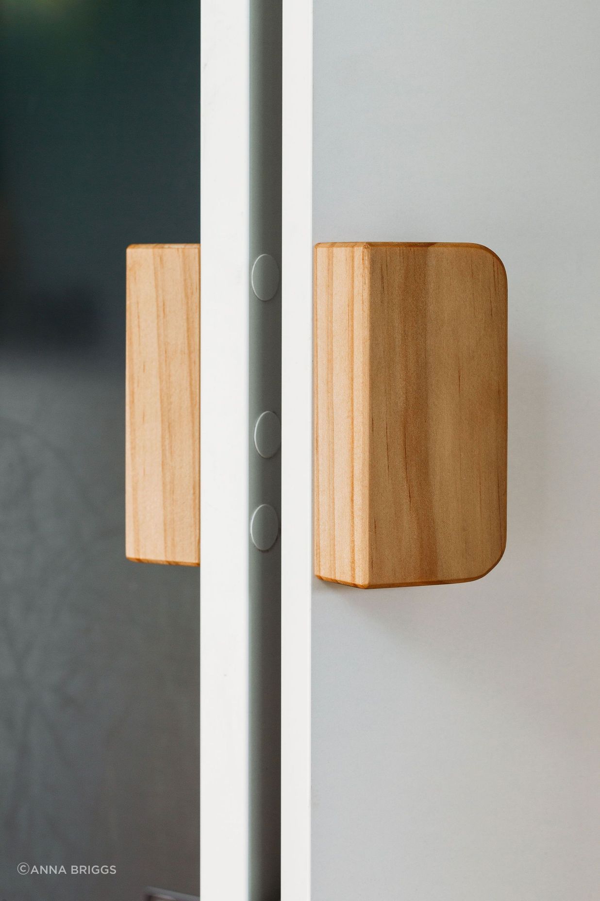 Lovely custom timber pull handles for the pantry.