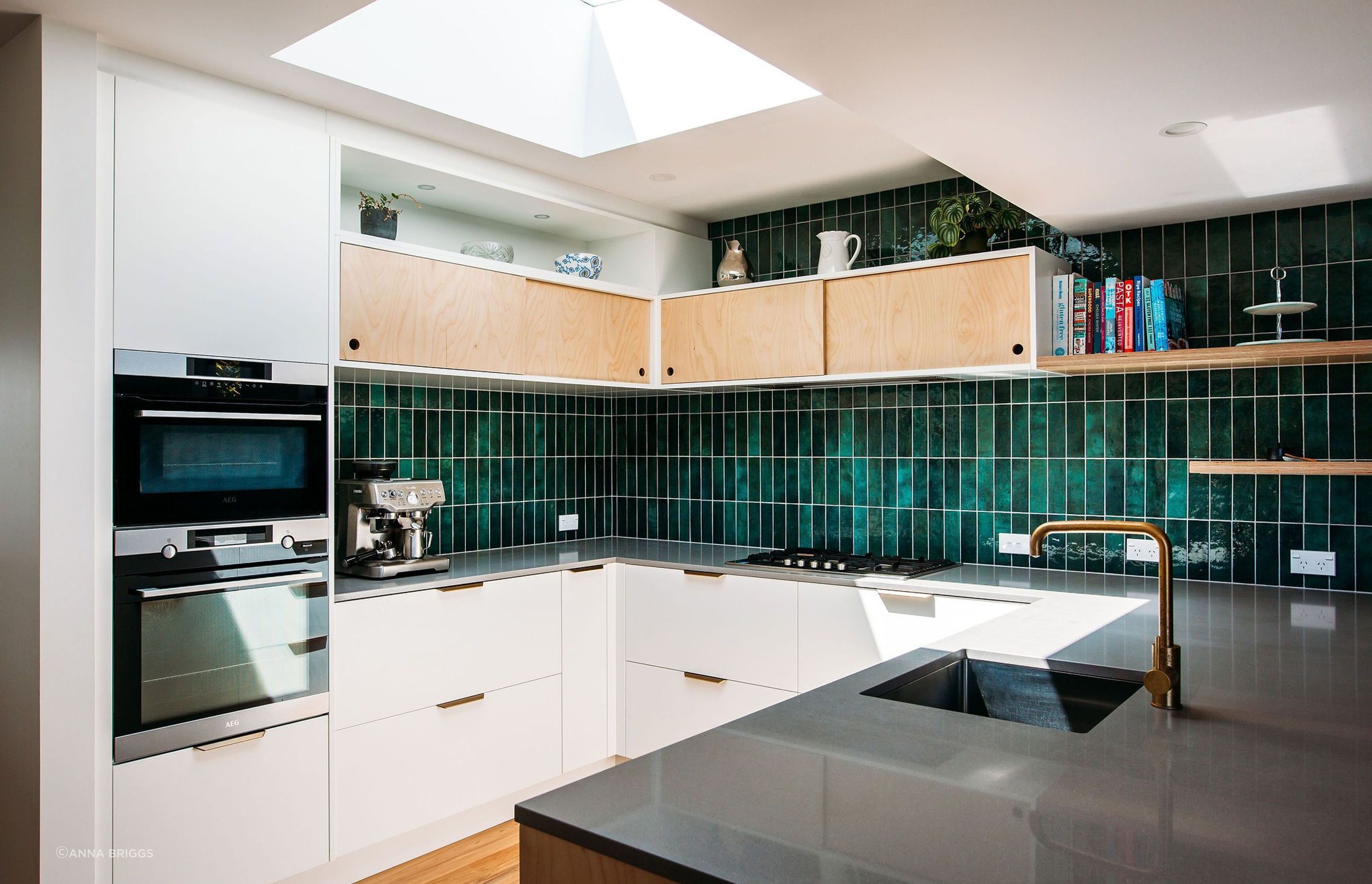 A great working layout with the sink, hob and ovens in a triangle. The fridge sits on the opposite wall.