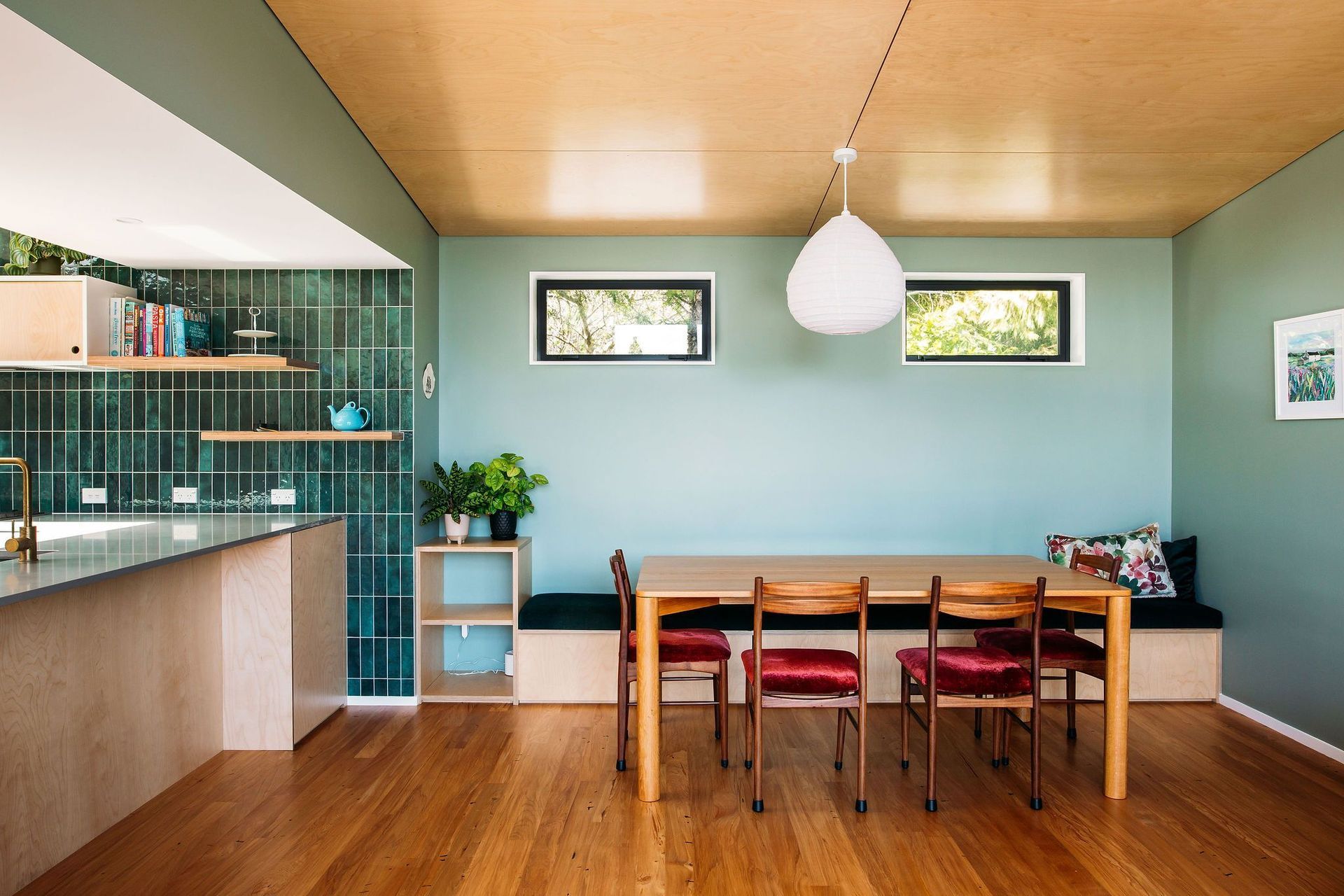 Lots of storage and space in the dining area with a built in bench seat and custom made squab.