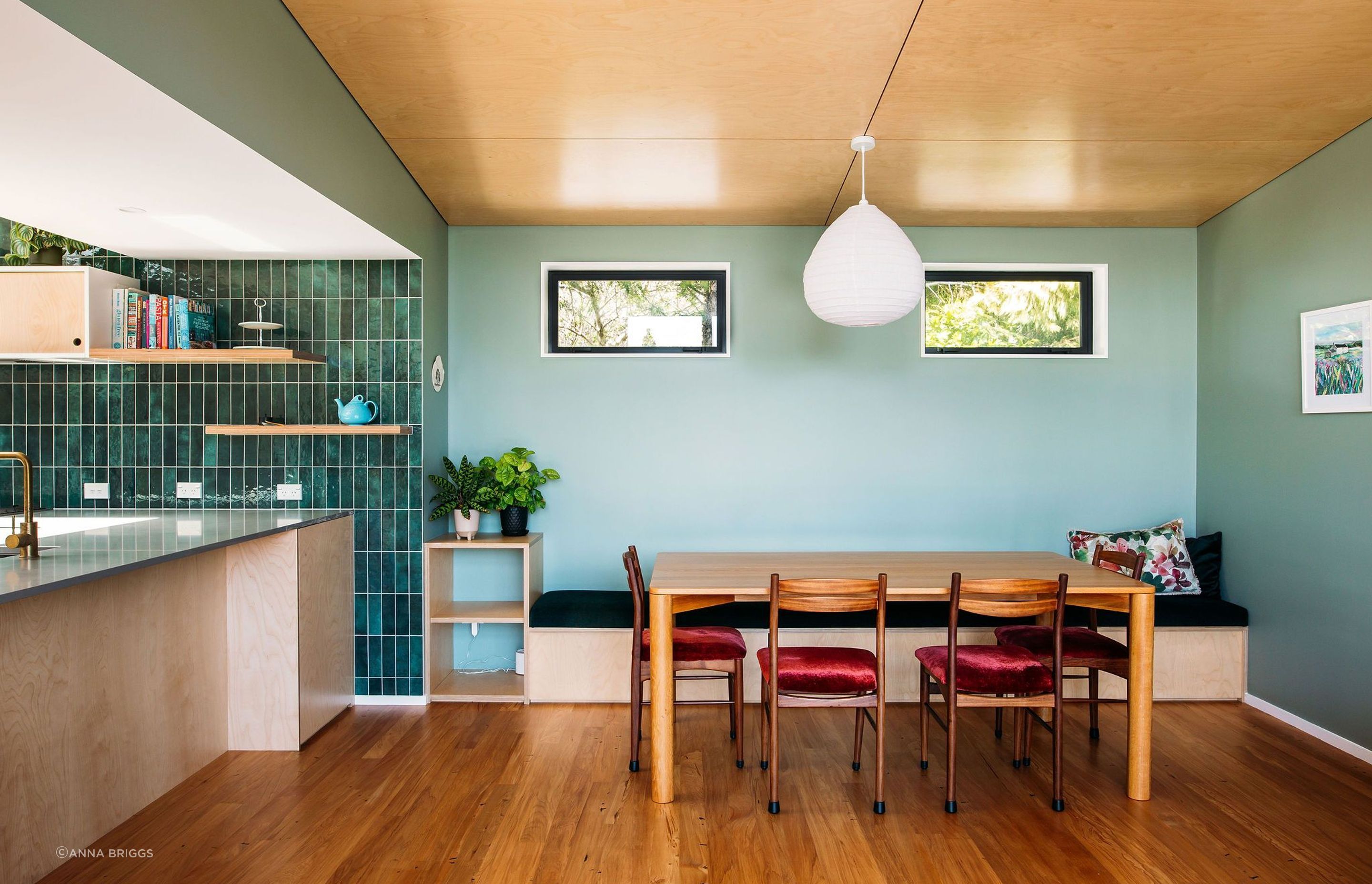 Lots of storage and space in the dining area with a built in bench seat and custom made squab.