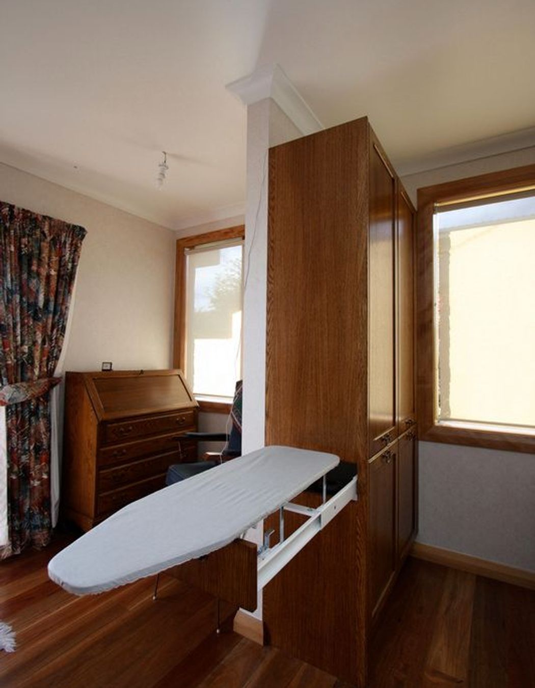 Hidden ironing board storage