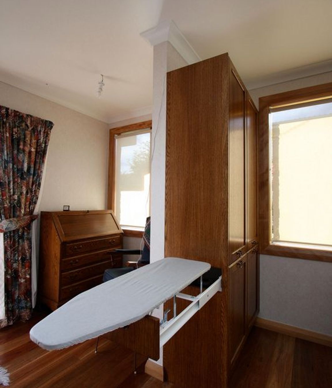 Hidden ironing board storage