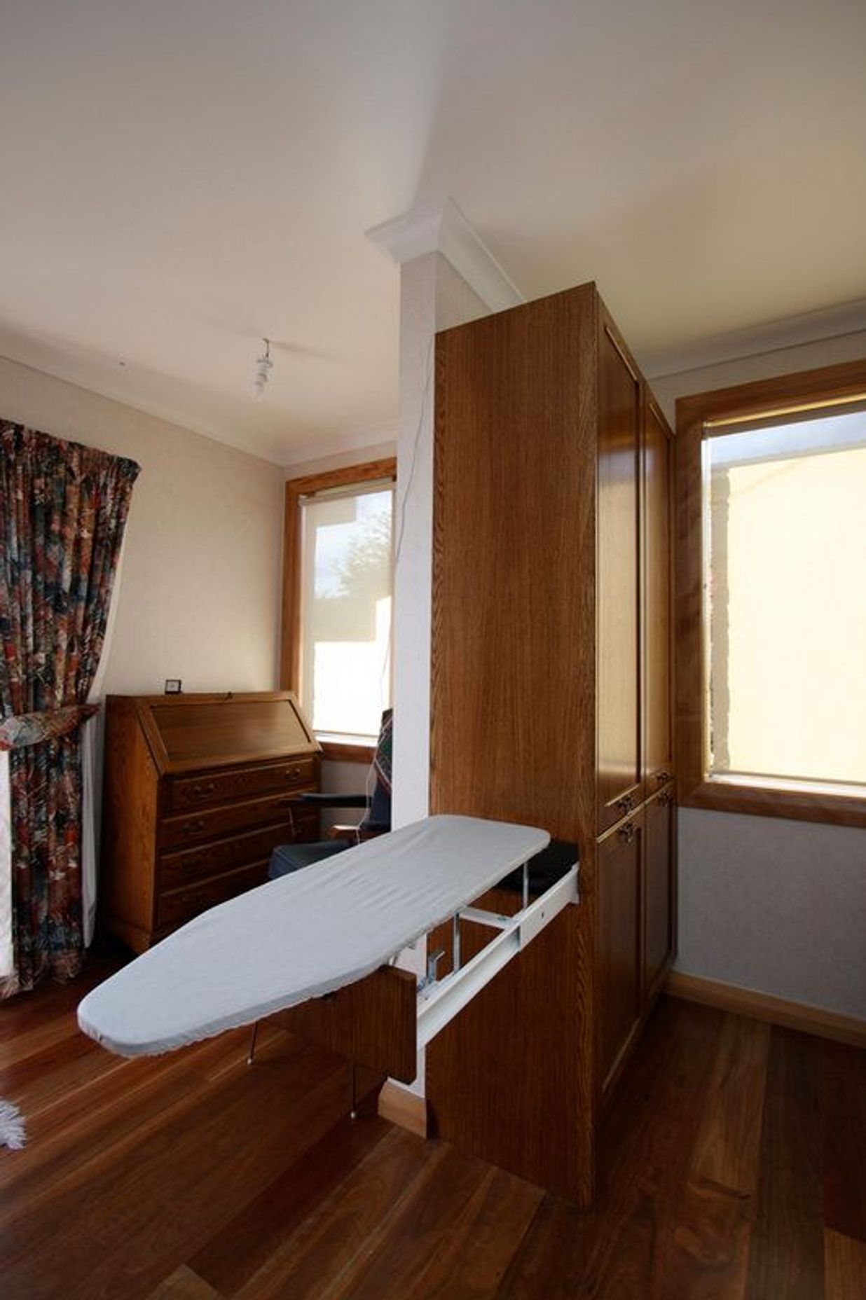 Hidden ironing board storage