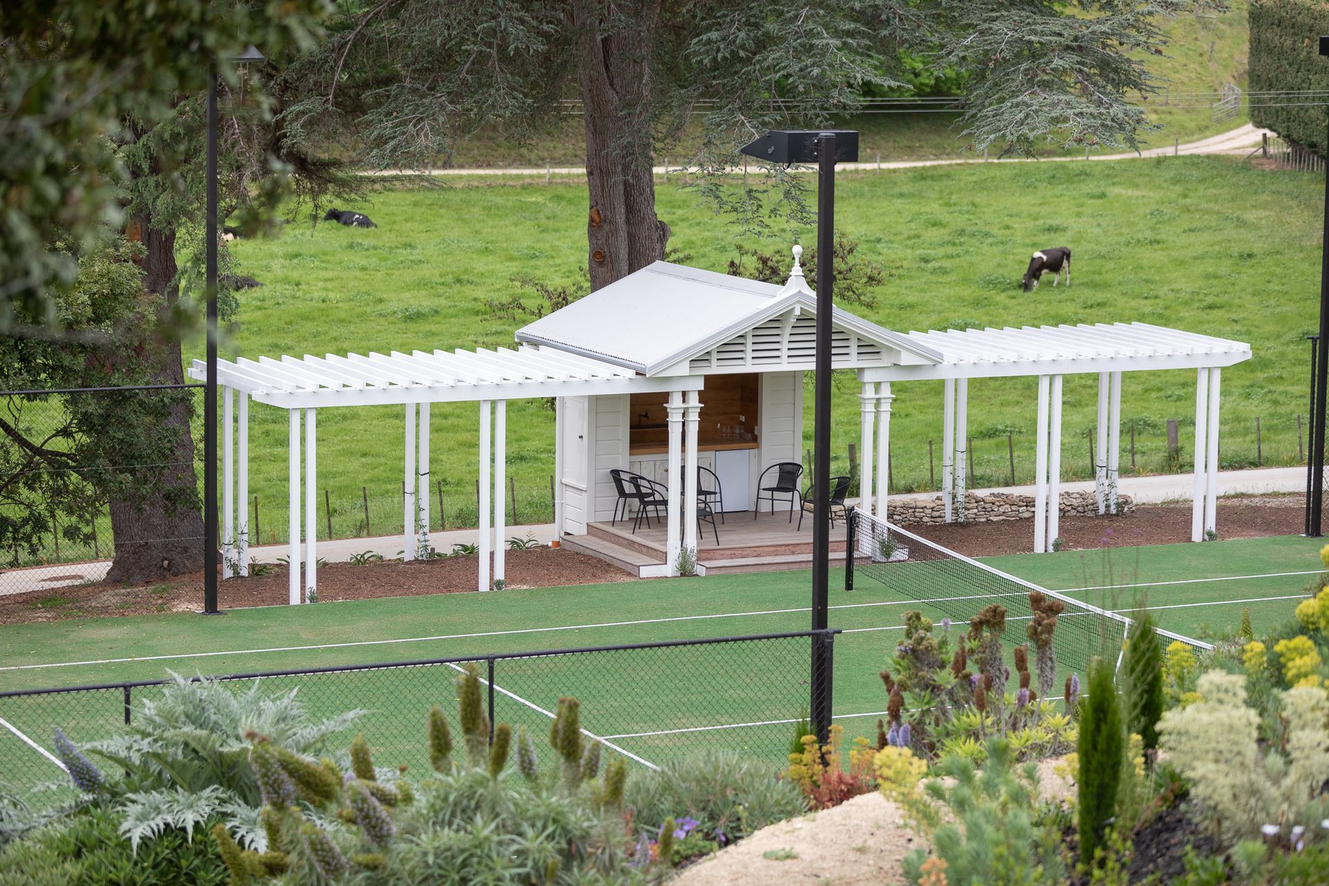 Tennis Pavilion built to complement the gorgeous villa. Roof ridgeline detail to match house.