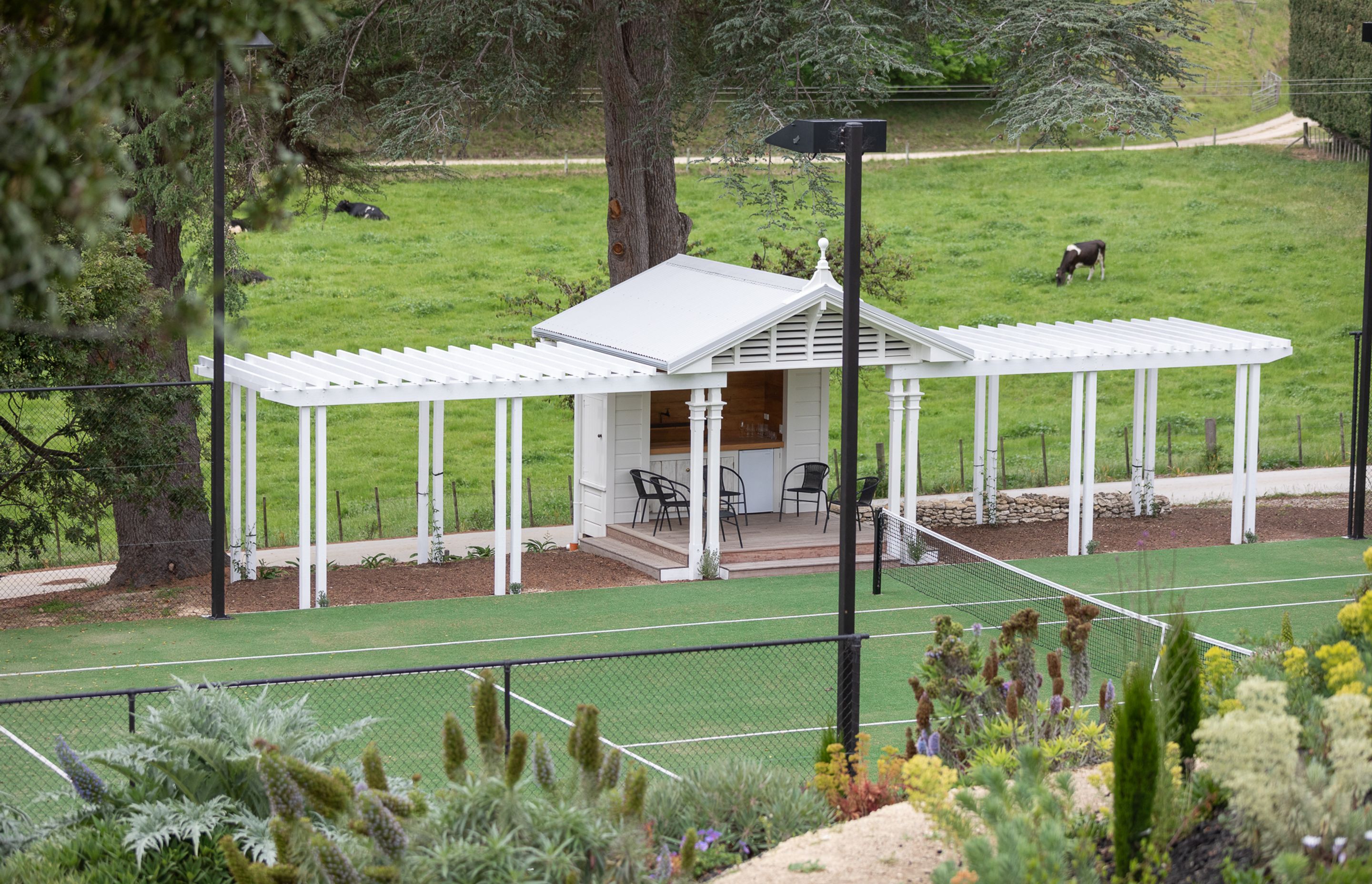 Tennis Pavilion built to complement the gorgeous villa. Roof ridgeline detail to match house.