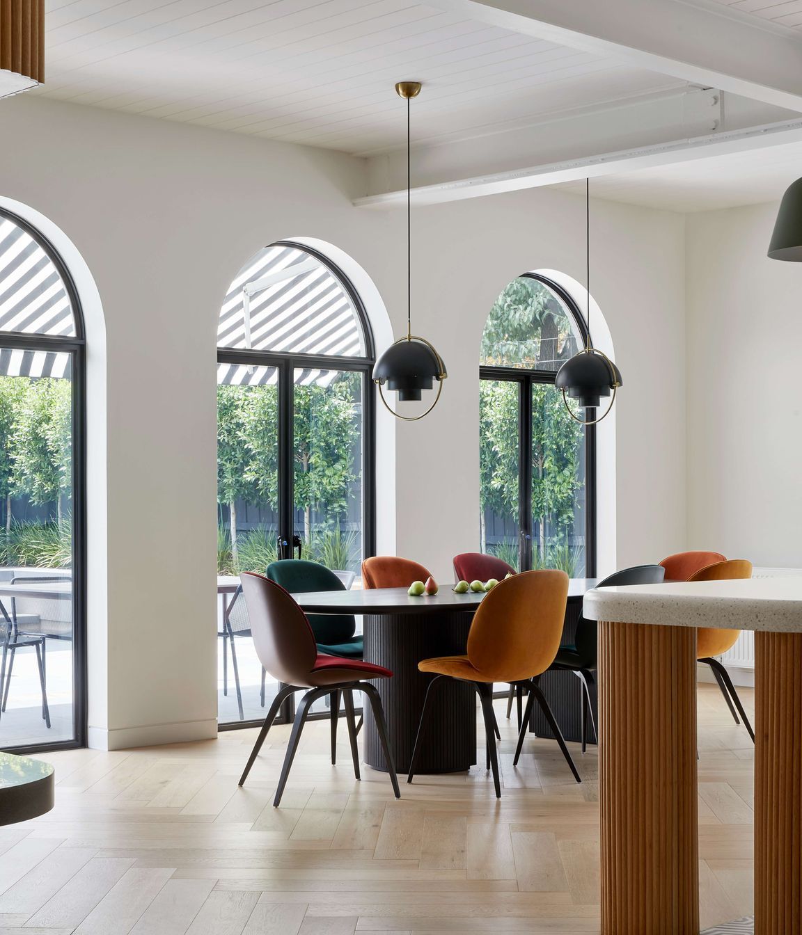 Modern inspired dining room in open plan kitchen, featuring flooring in pale oak in a herringbone pattern from Havwoods, a nod to the art deco period of the home. Located in Melbourne, see more from our Arch Deco Project