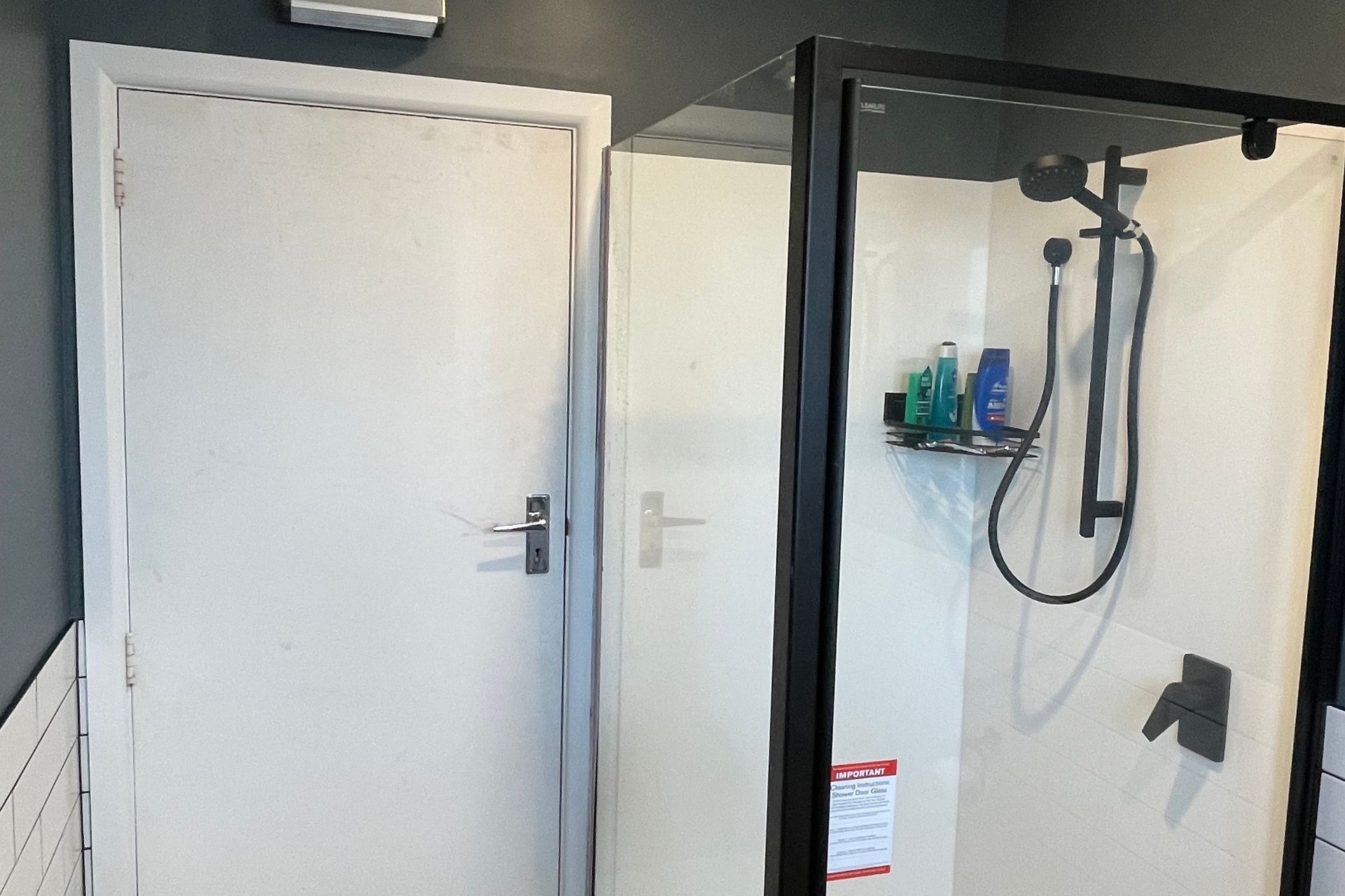 Black framed shower with black fixtures