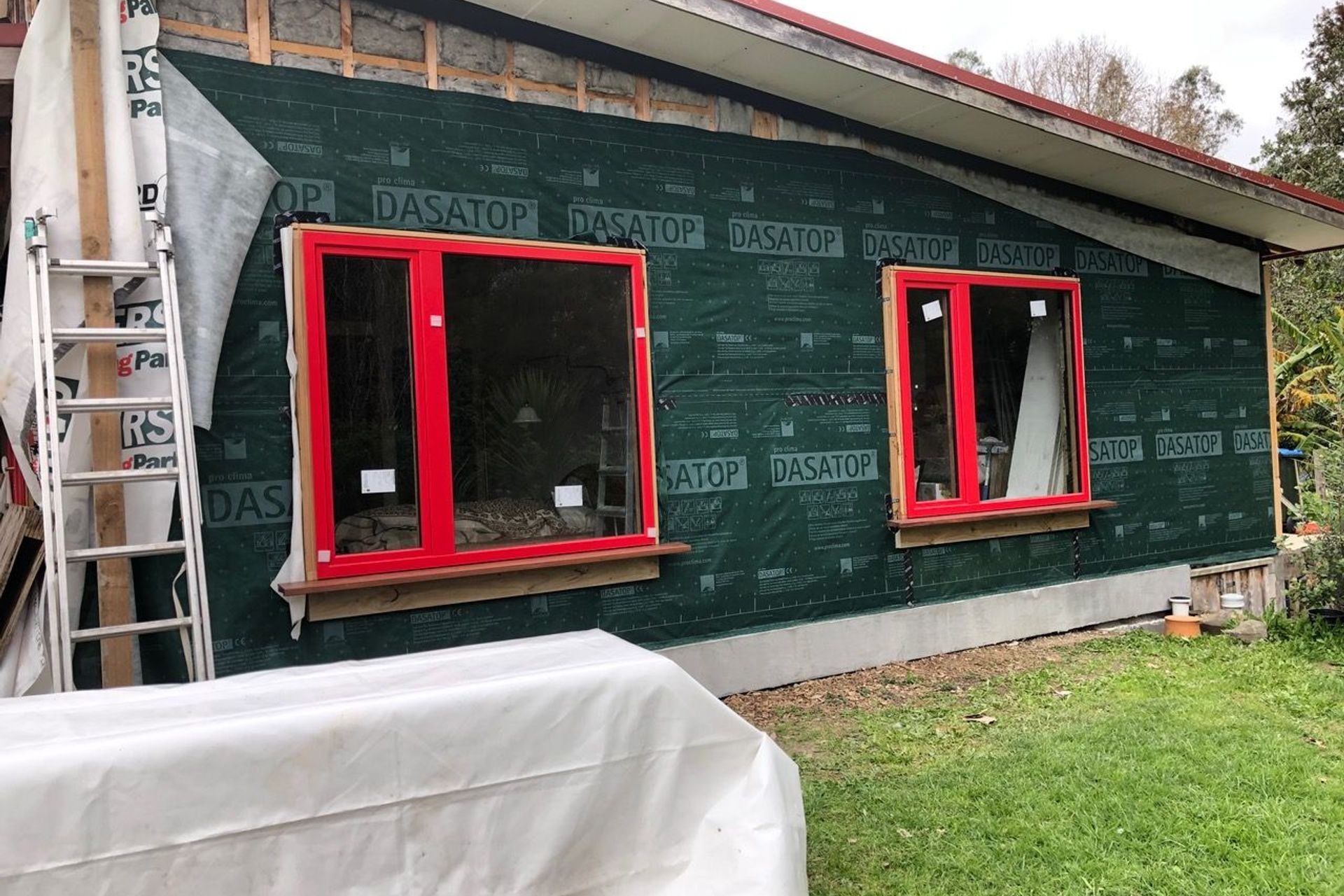 DASATOP membrane being applied to the external walls for airtightness