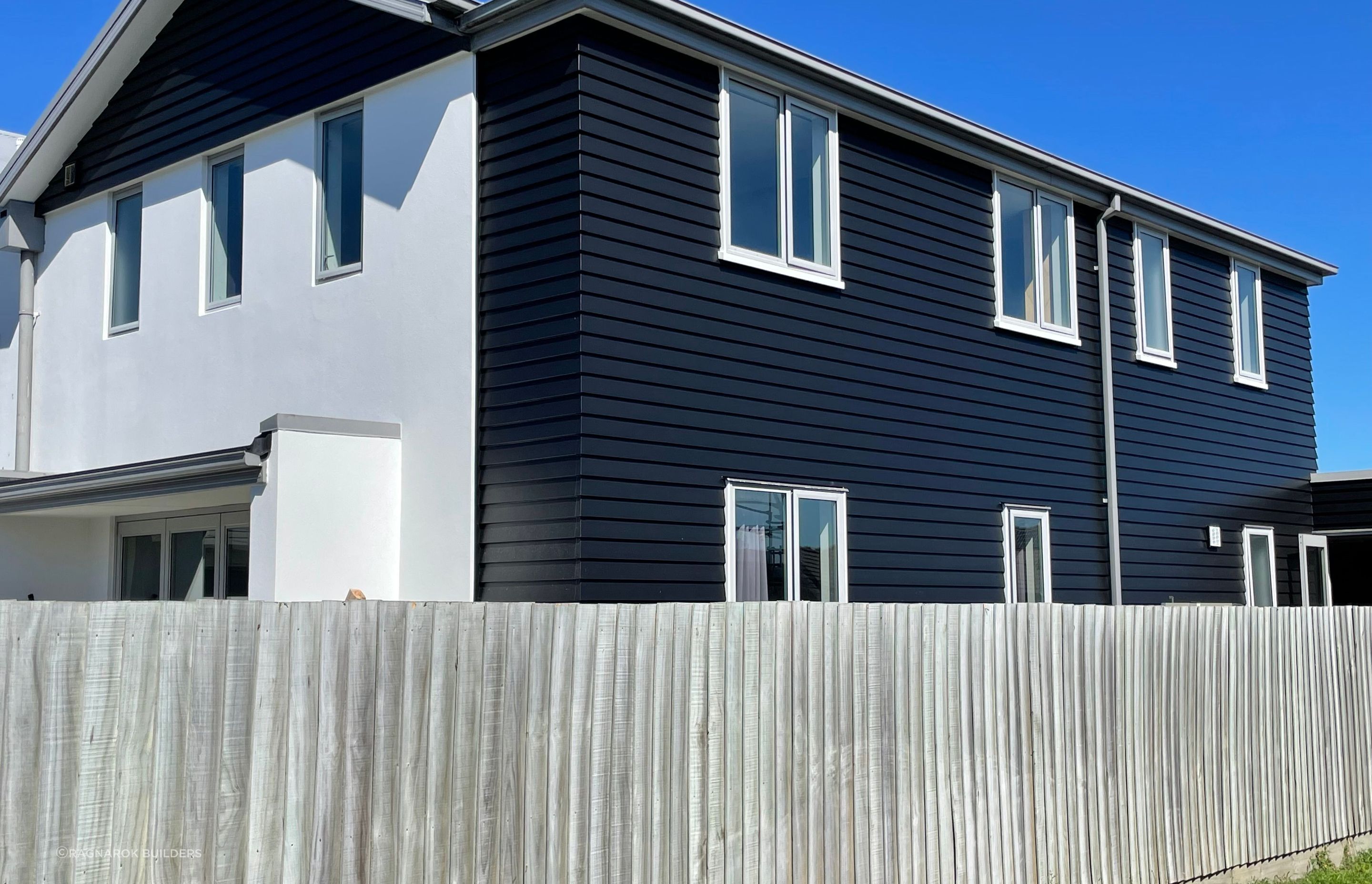 Dulux Weathershield semi gloss weatherboards, RMaxx plaster system finished in black/white