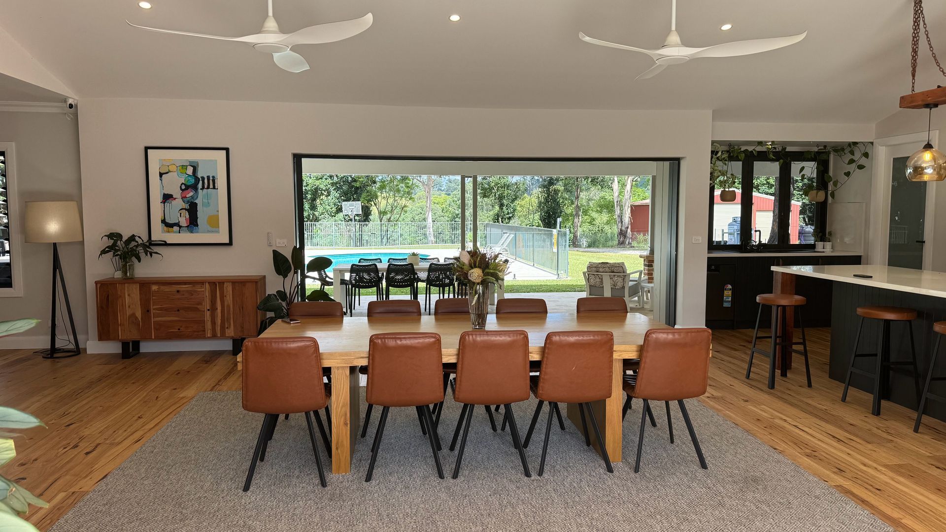 The large door openings on both sides of this living space create a generous space that really connects you with outside. video