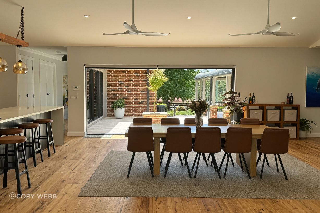The sun drenches the living space from the winter courtyard.