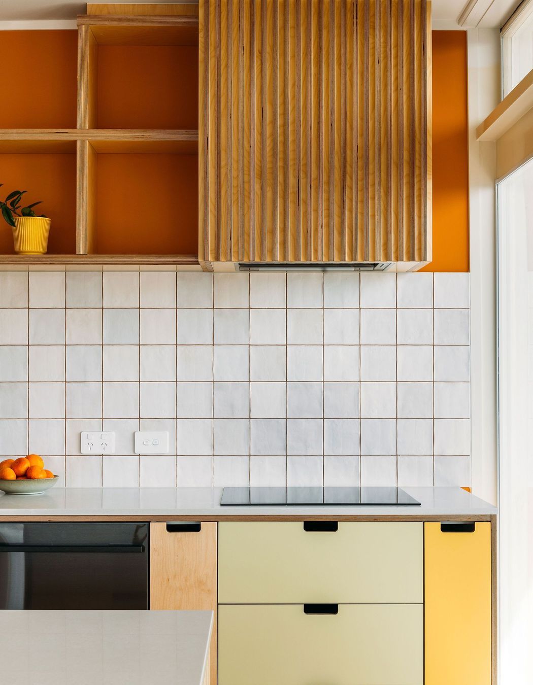 A simple cut-out handle in the HPL drawers.