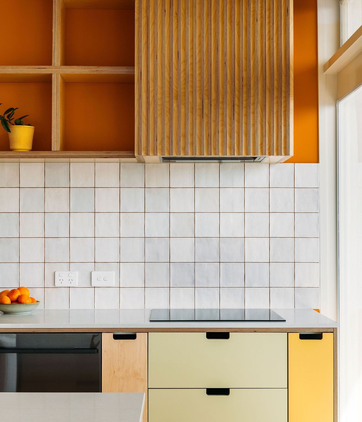 A simple cut-out handle in the HPL drawers.