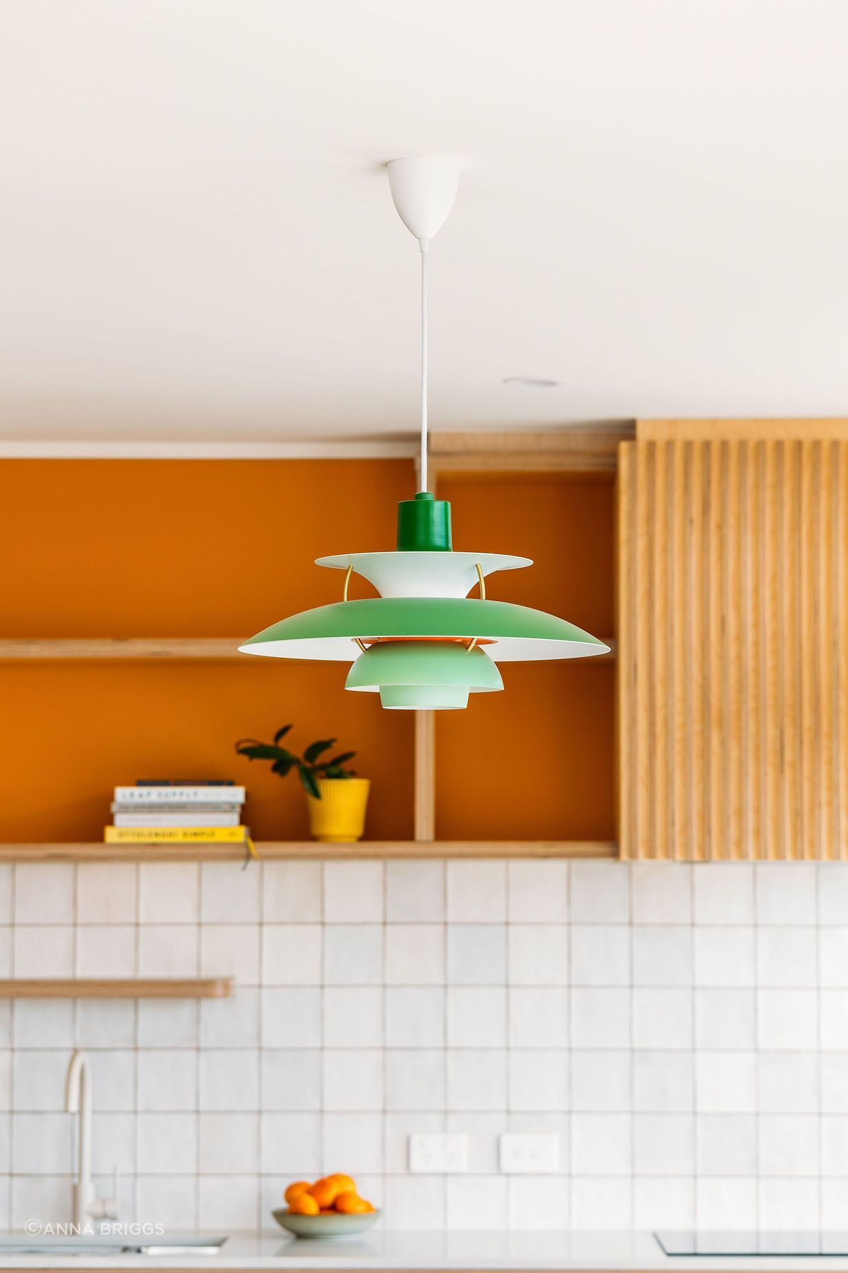 The replica PH5 lamp sits in perfect harmony with the mid-century inspired design and colour scheme.