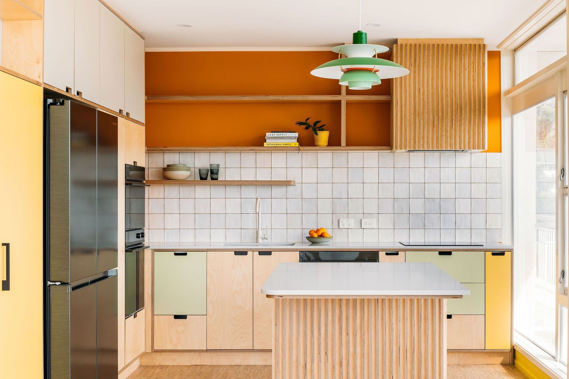 A practical kitchen design, with lots of storage in the apartment setting.