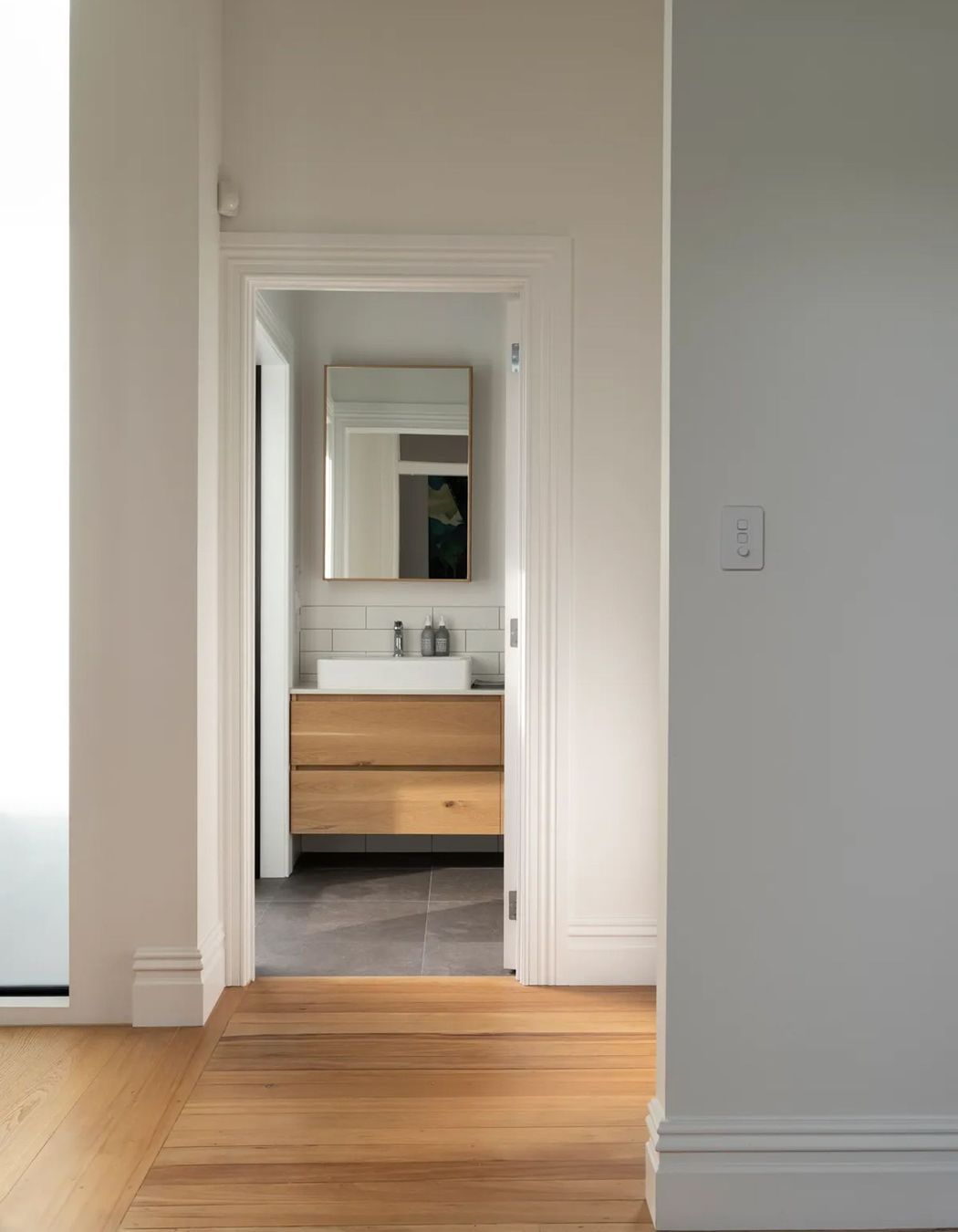 Oak flooring runs throughout the top level.