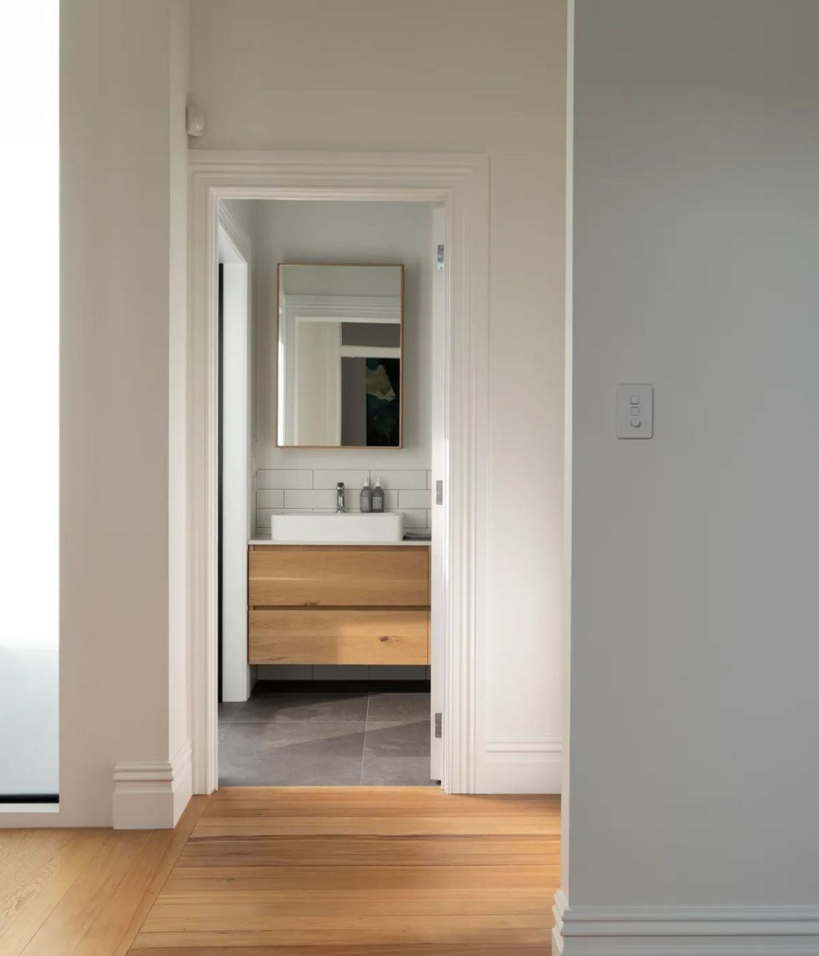 Oak flooring runs throughout the top level.