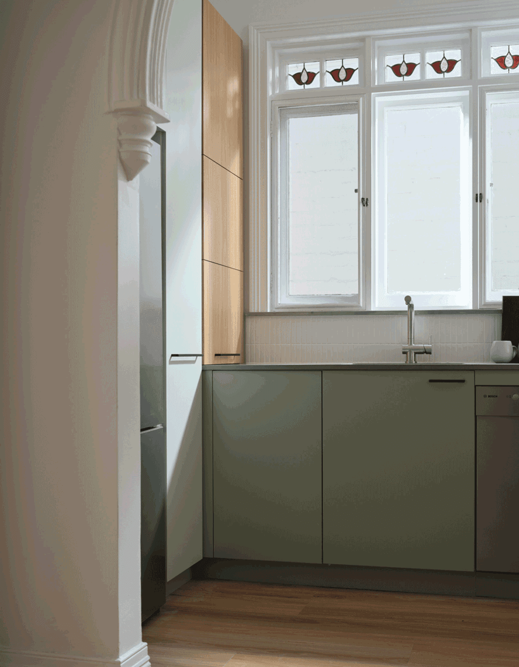 Blind corner baskets and a slide-out appliance shelf accessed by a lift-up door make the most of every nook of this kitchen.