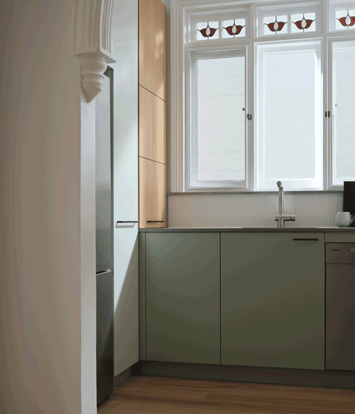 Blind corner baskets and a slide-out appliance shelf accessed by a lift-up door make the most of every nook of this kitchen.