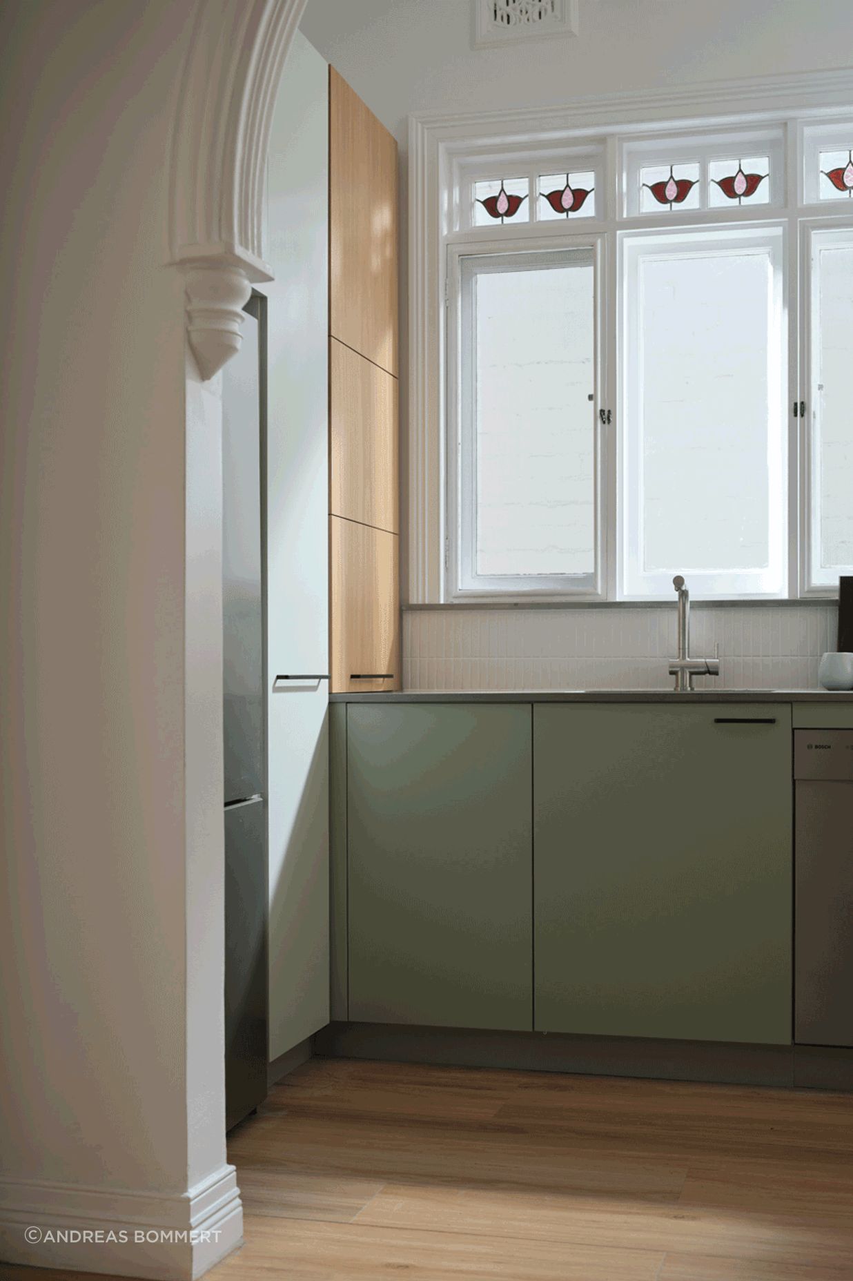 Blind corner baskets and a slide-out appliance shelf accessed by a lift-up door make the most of every nook of this kitchen.