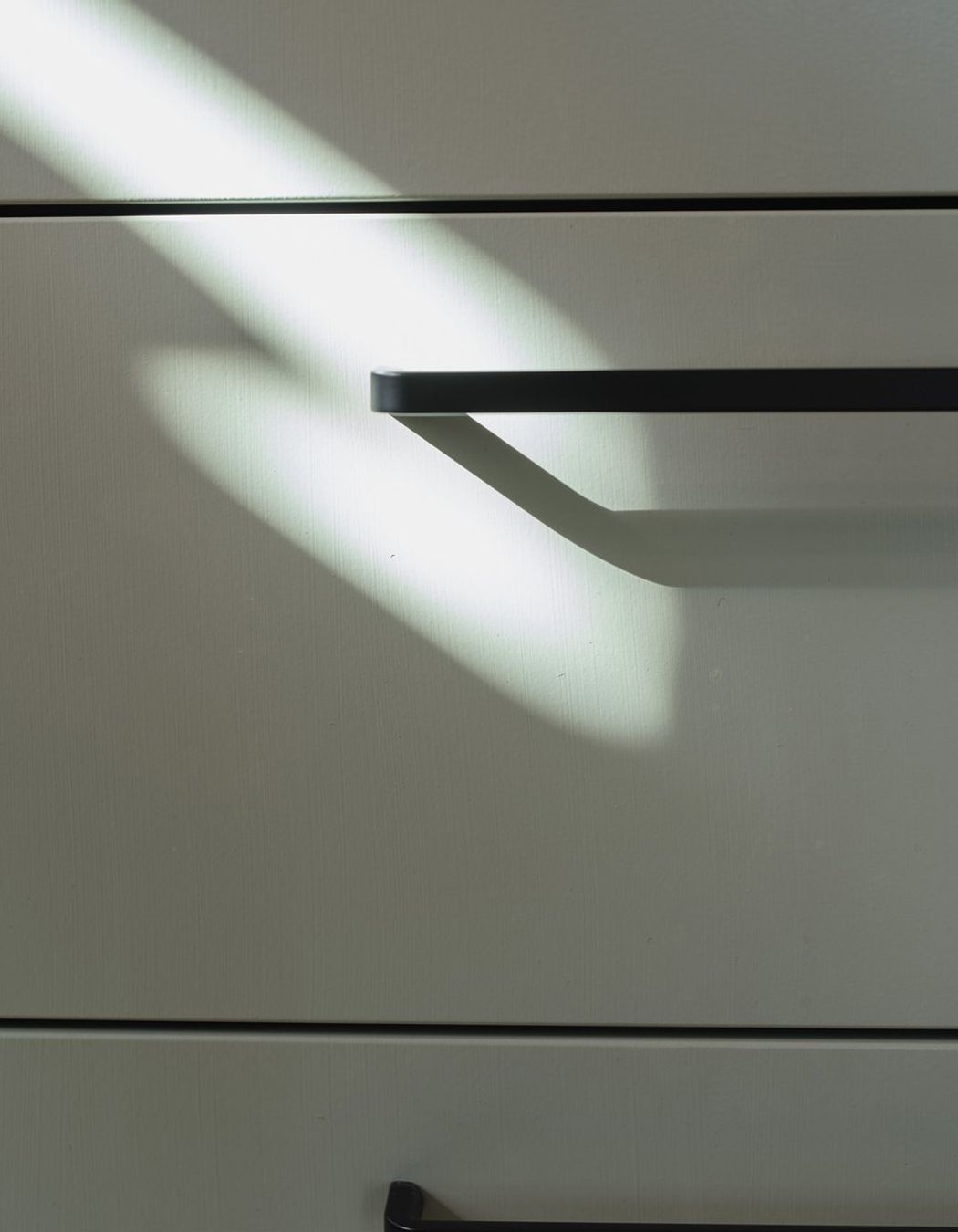 Simple black ‘D’ handles are a stylish, functional and affordable hardware choice.