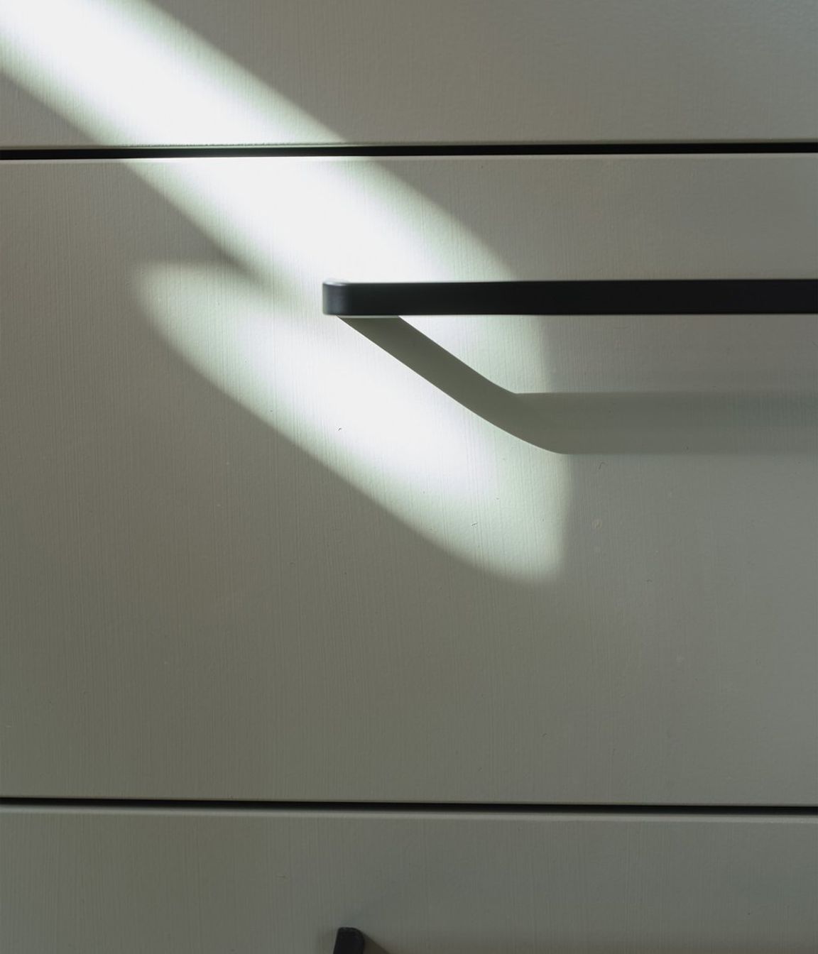 Simple black ‘D’ handles are a stylish, functional and affordable hardware choice.