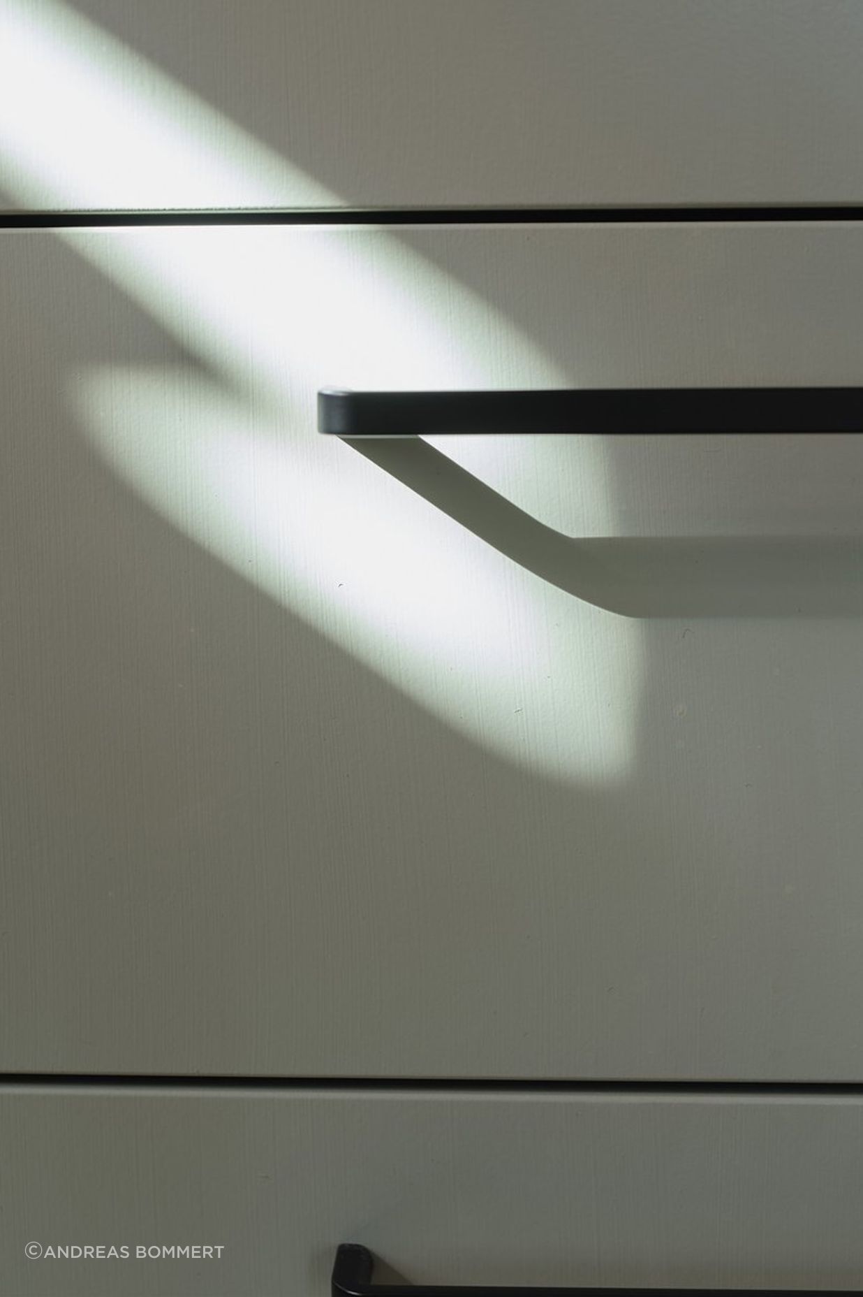 Simple black ‘D’ handles are a stylish, functional and affordable hardware choice.