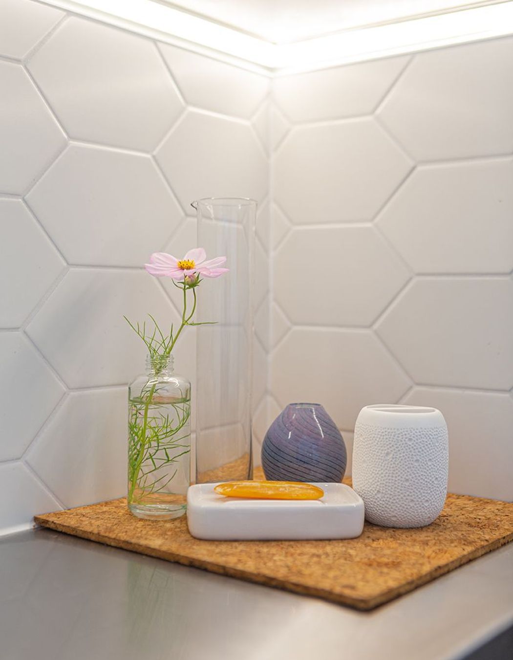 Tiled splashback on three sides, and LED strip lighting creates a great workspace.