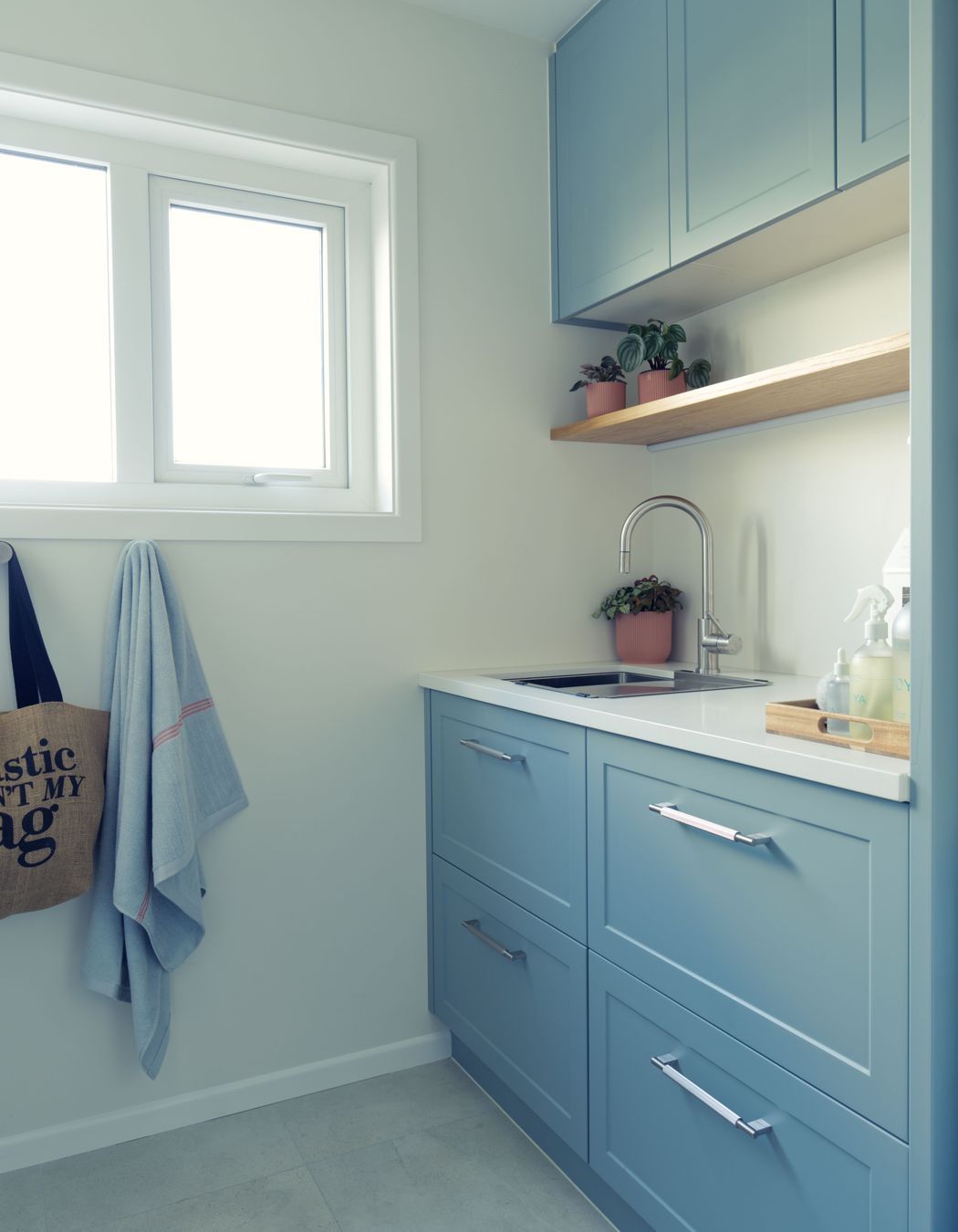 Small and functional laundry design with traditional design elements.