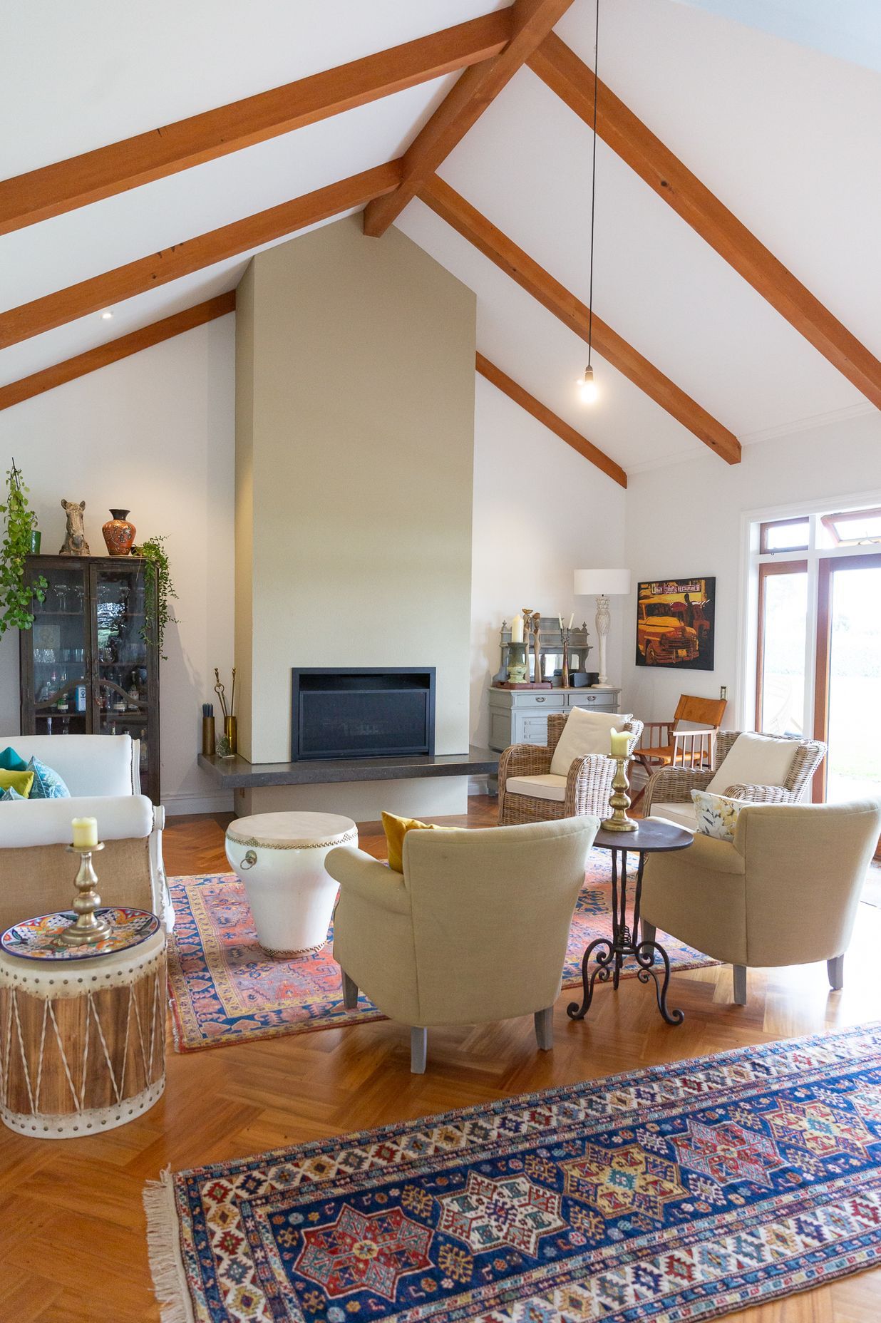 beautiful timber beams highlight the angles in the lounge room ceiling