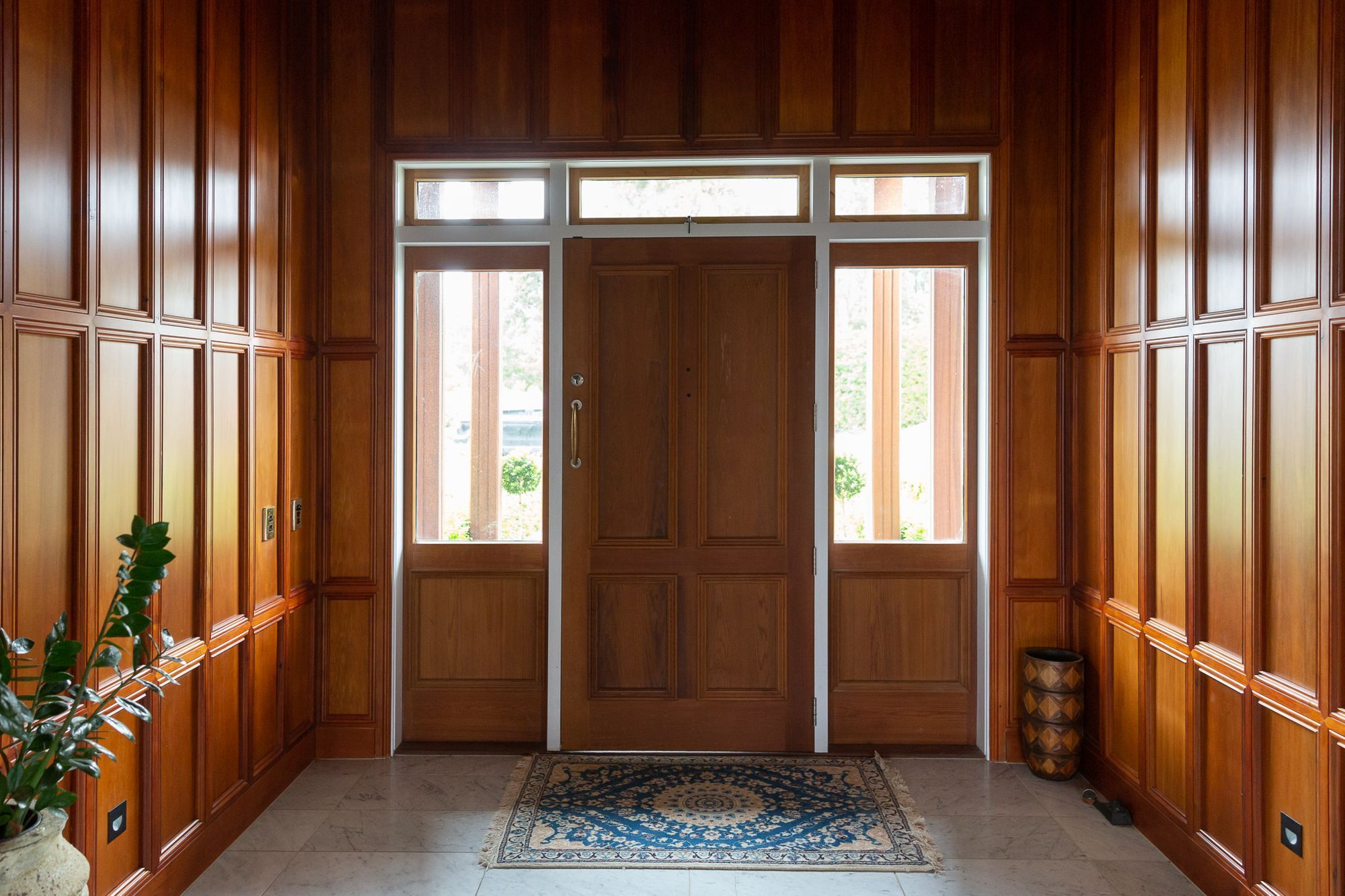 The paneling in the entrance is an absolute show stopper. The moldings used are produced by our amazing team to add a touch of magic to this hallway.