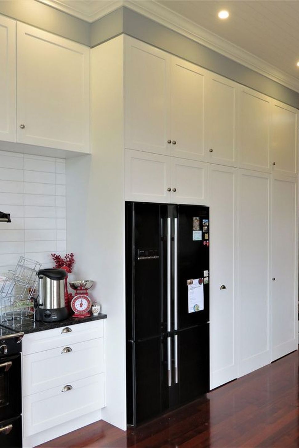 Kitchen cabinetry working in with the wall
