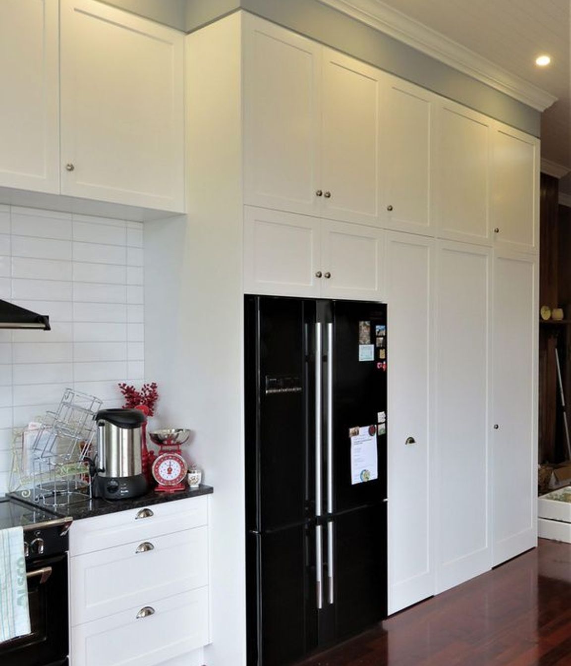 Kitchen cabinetry working in with the wall