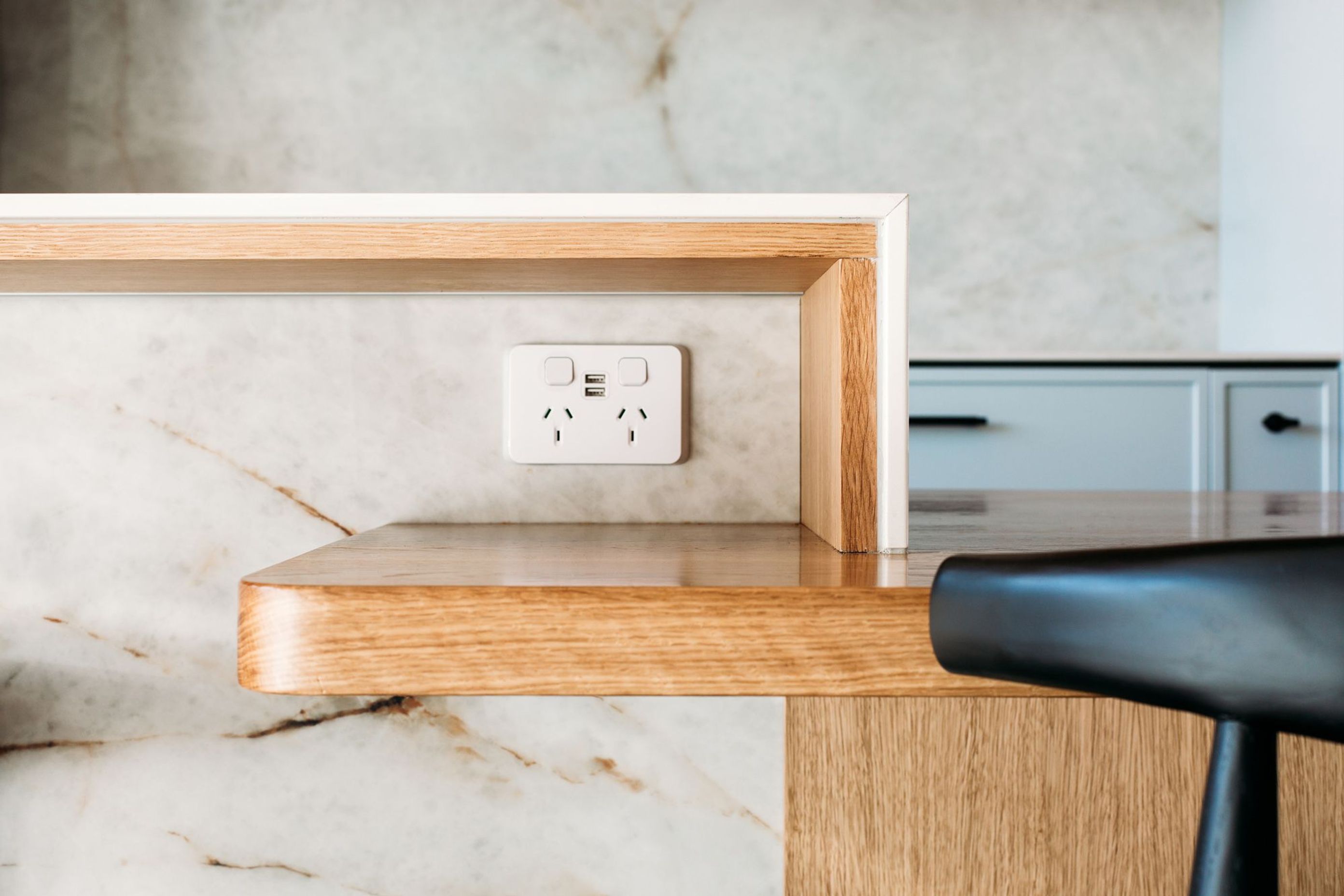 This solid oak shelf is a tidy nook to house charging phones, the pen box and the shopping list.