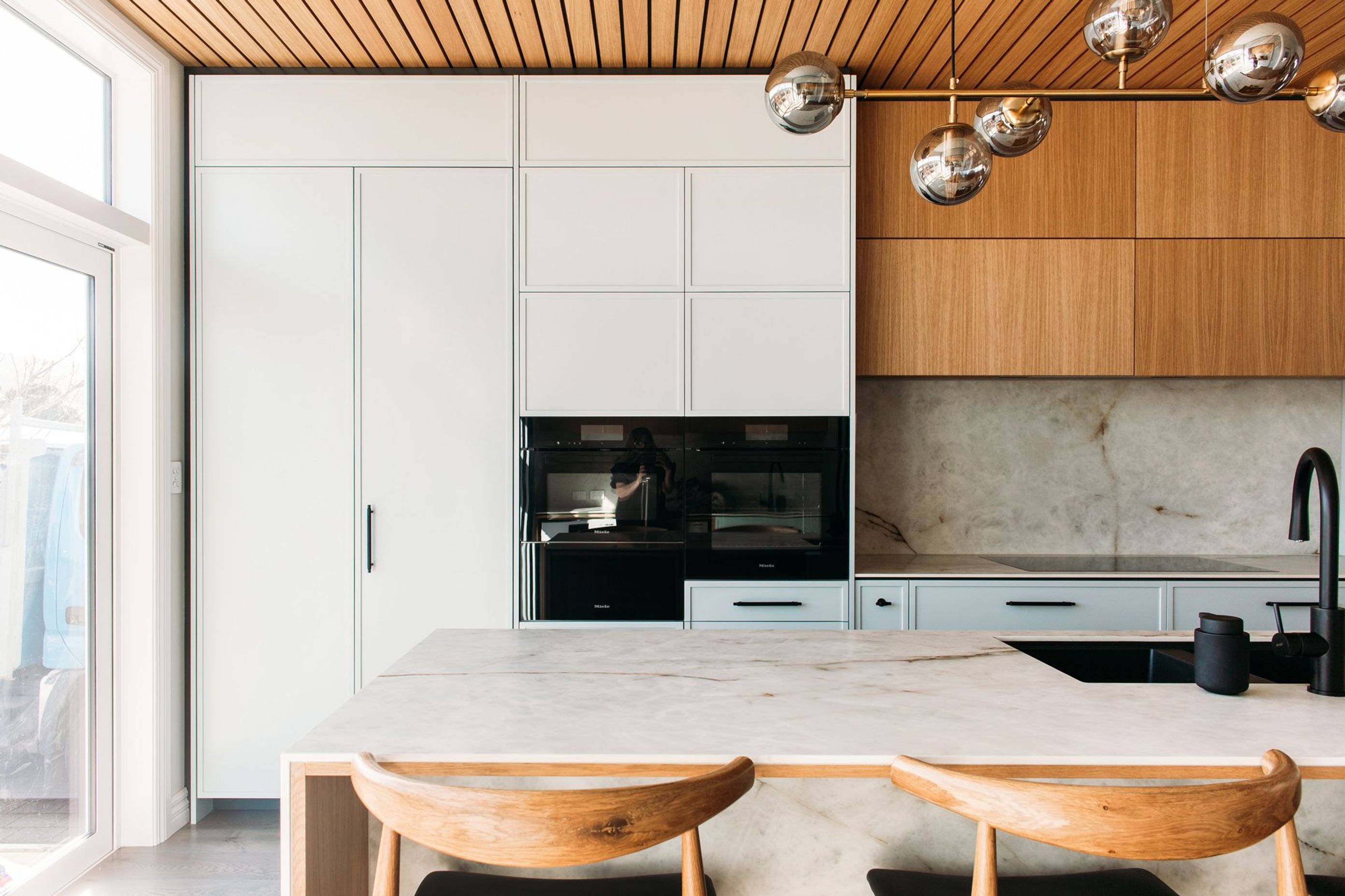 Miele appliances complete this state of the art kitchen design.
