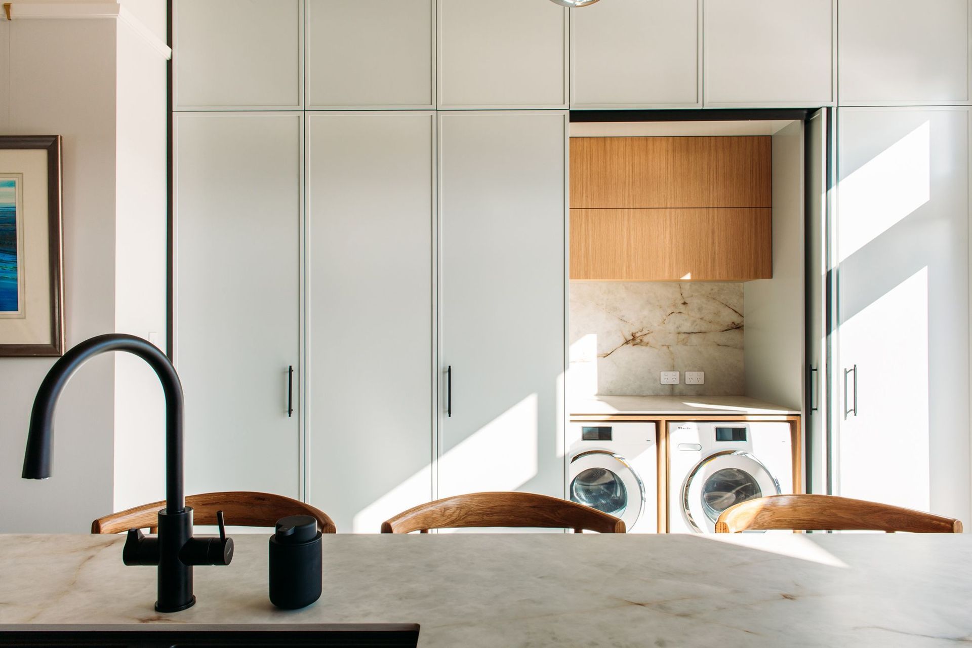 The laundry incorporates Hafele pocket doors.