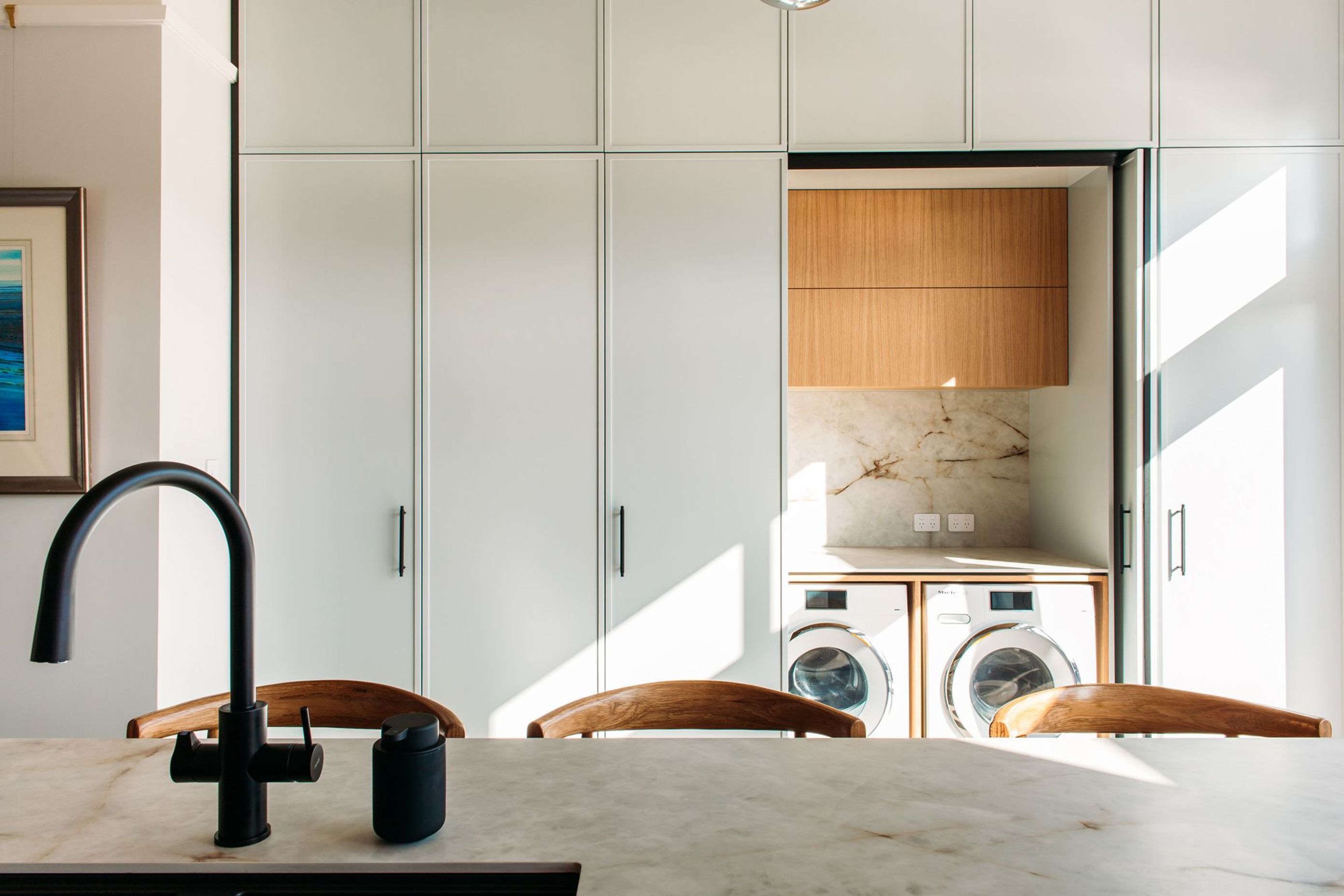 The laundry incorporates Hafele pocket doors.