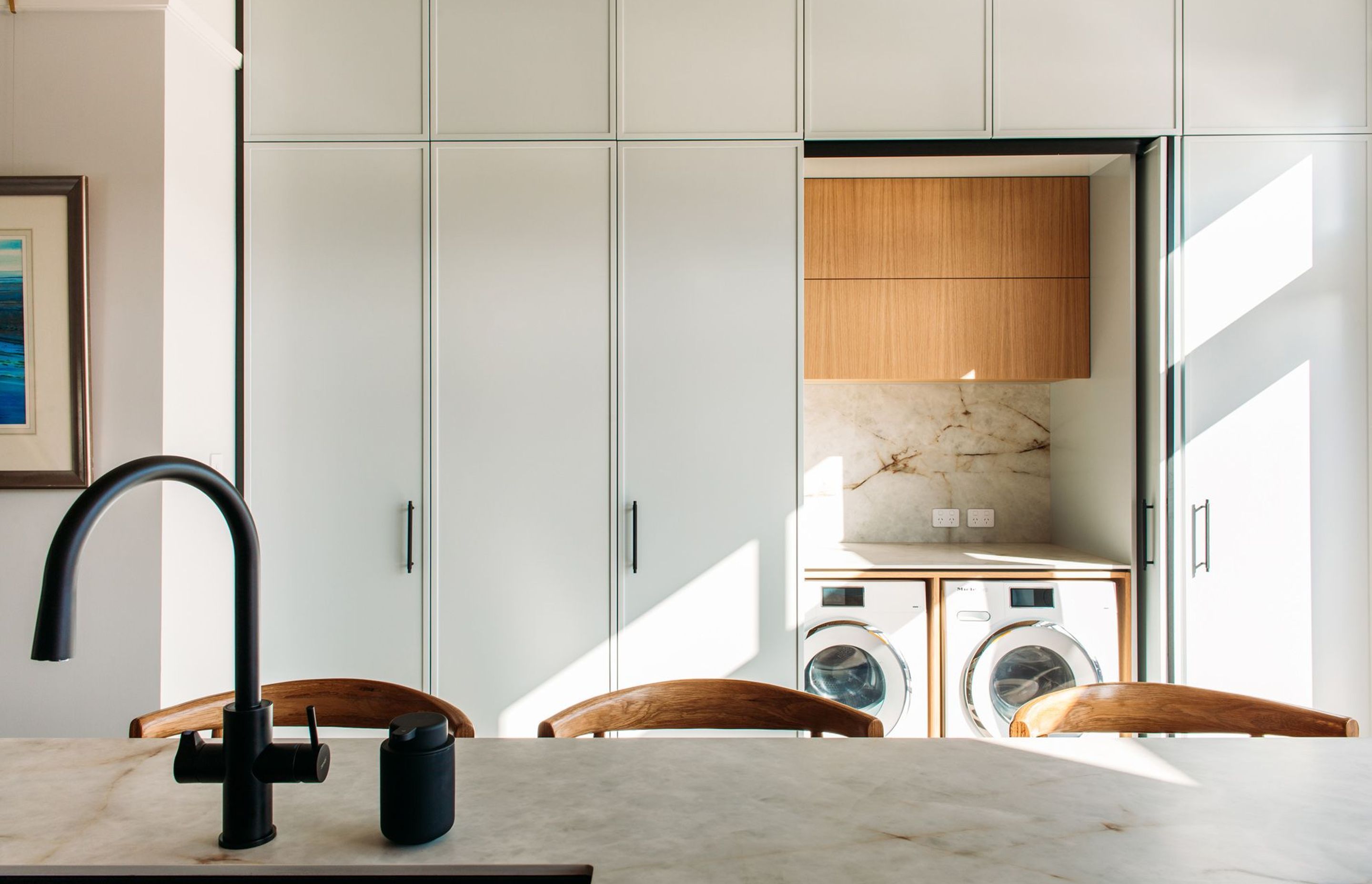 The laundry incorporates Hafele pocket doors.