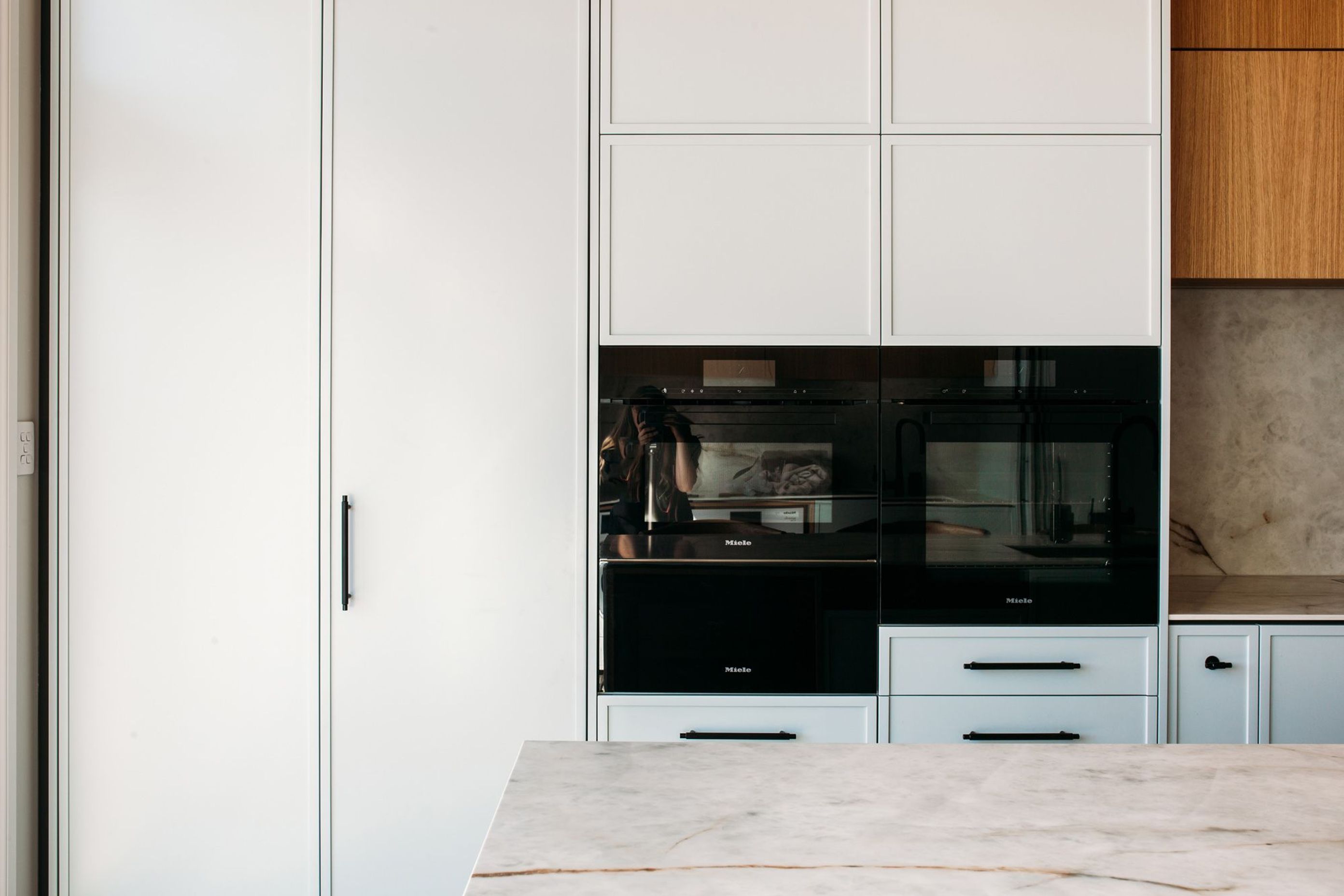 Contemporary shaker style cabinetry, with modern detailing, and perfectly executed in soft powder blue.