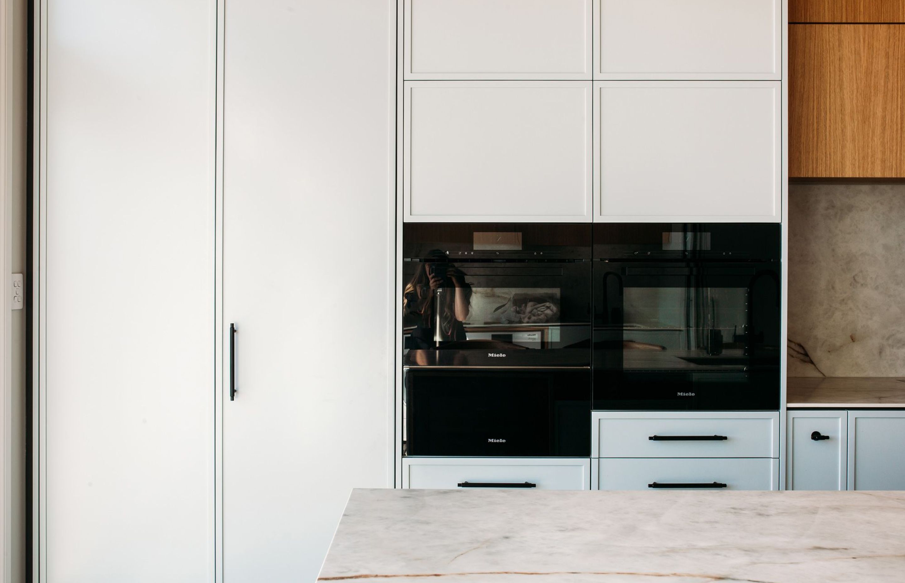 Contemporary shaker style cabinetry, with modern detailing, and perfectly executed in soft powder blue.