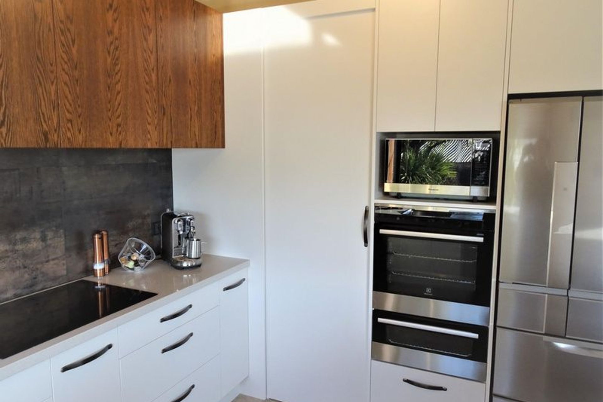 Showing the hidden sliding door storage area and joinery