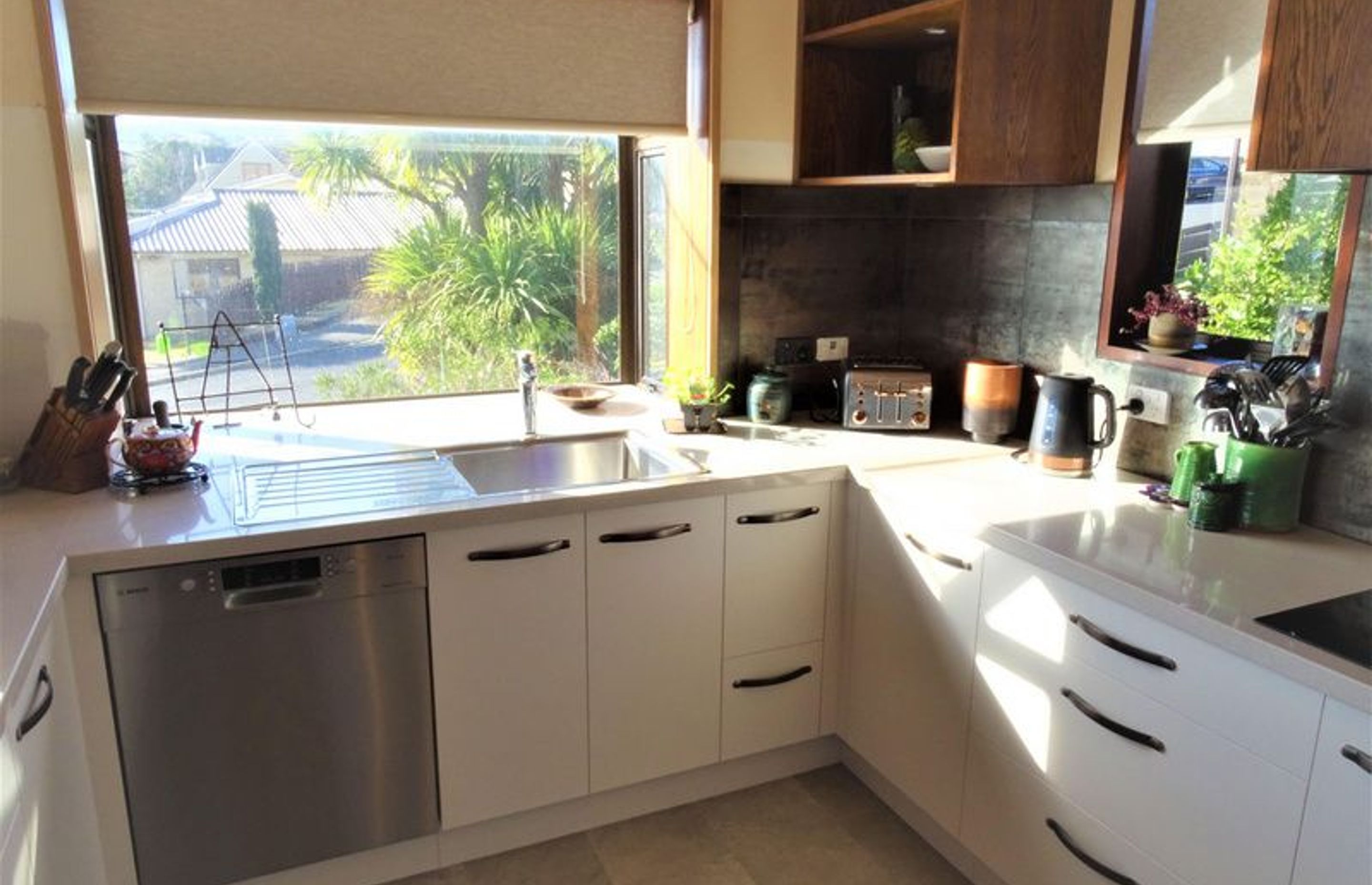 Large kitchen window adding light and interest to the room