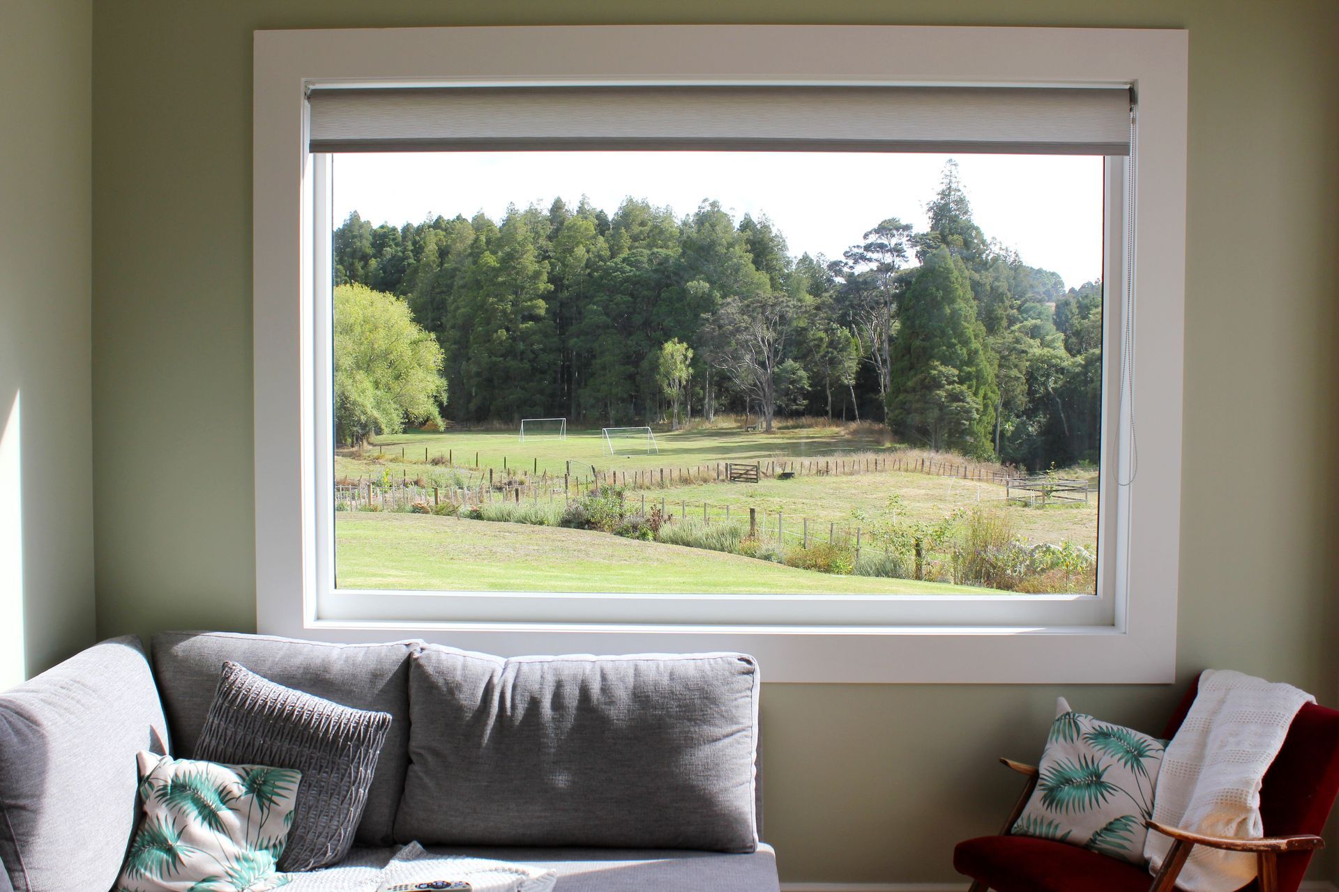 Cain Built - Coatesville Bungalow renovation- Feature picture frame window looking out to bush