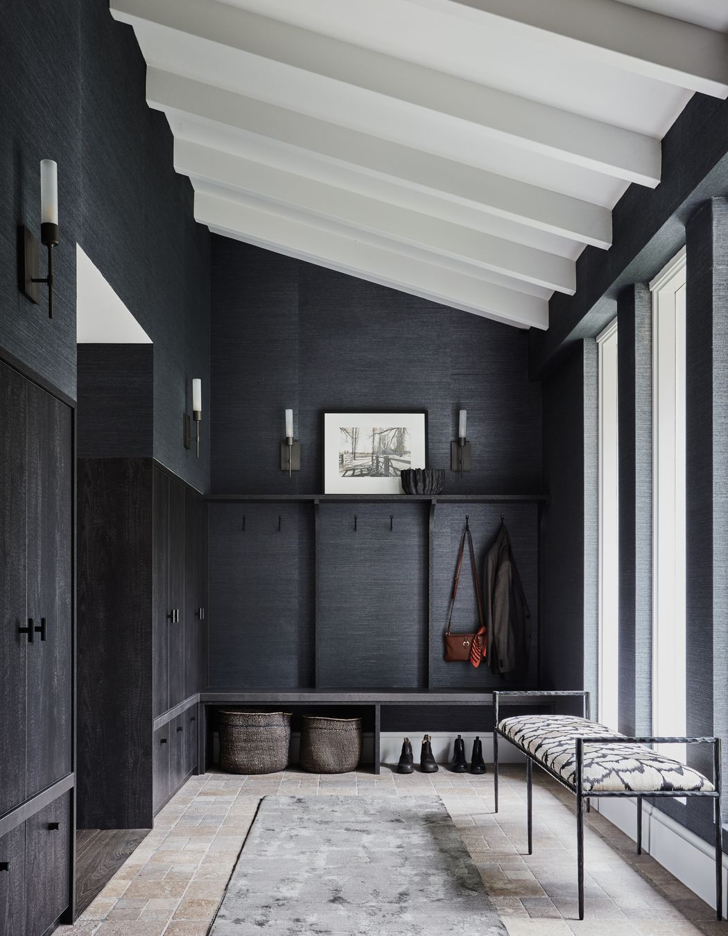 FOYER Phillip Jeffries ‘Manila Hemp’ wallpaper in Charcoal, The Textile Company. Torno wall lights, Blueprint Lighting. Sydney wall hooks, Hepburn Hardware. Berliner runner, Robyn Cosgrove. Arteriors ‘Barbana’ bench, Boyd Blue. Dark travertine cobbles, Aeria Country Floors.